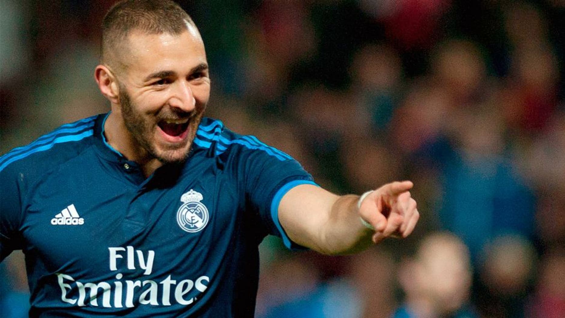 Real Madrid's French forward Karim Benzema celebrates a goal during the Spanish league football match Granada FC vs Real Madrid CF at Nuevo Los Carmenes stadium in Granada on February 7, 2016. AFP PHOTO / JORGE GUERRERO / AFP / Jorge Guerrero (Photo credit should read JORGE GUERRERO/AFP/Getty Images)