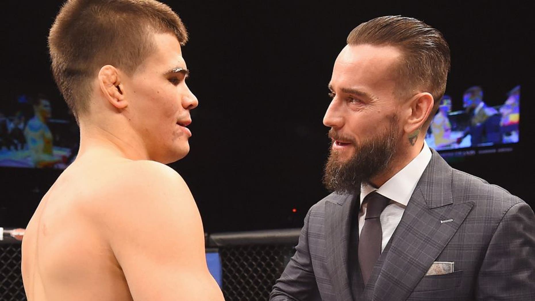 LAS VEGAS, NV - FEBRUARY 06: (R-L) Phil 'CM Punk' Brooks congratulates Mickey Gall after Gall's victory over Mike Jackson during the UFC Fight Night event at MGM Grand Garden Arena on February 6, 2016 in Las Vegas, Nevada. (Photo by Jeff Bottari/Zuffa LLC/Zuffa LLC via Getty Images)