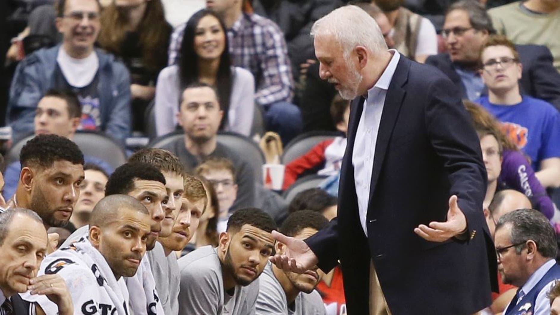 Feb 8, 2015; Toronto, Ontario, CAN; San Antonio Spurs head coach Gregg Popovich talks to his players during the second half against the Toronto Raptors at the Air Canada Centre. Toronto defeated San Antonio 87-82. Mandatory Credit: John E. Sokolowski-USA TODAY Sports