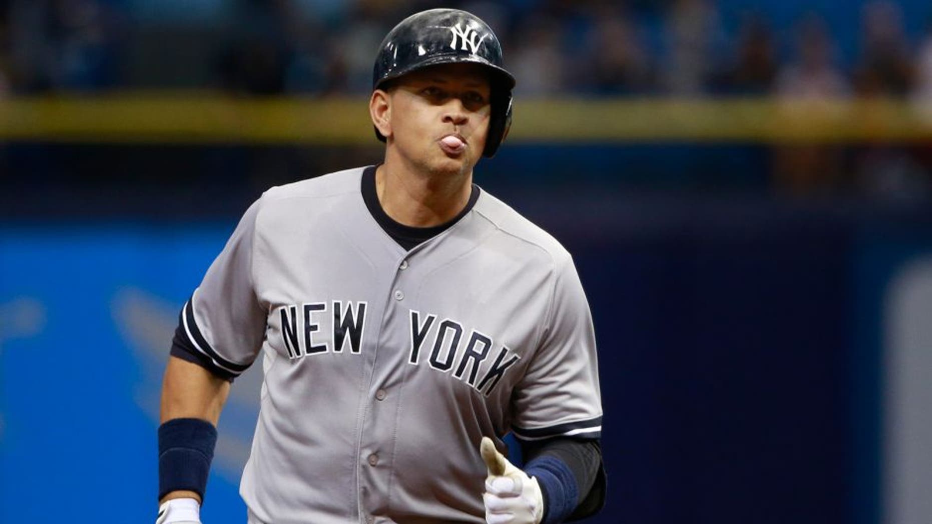 Sep 15, 2015; St. Petersburg, FL, USA; New York Yankees designated hitter Alex Rodriguez (13) hits a solo home run during the first inning against the Tampa Bay Rays at Tropicana Field. Mandatory Credit: Kim Klement-USA TODAY Sports