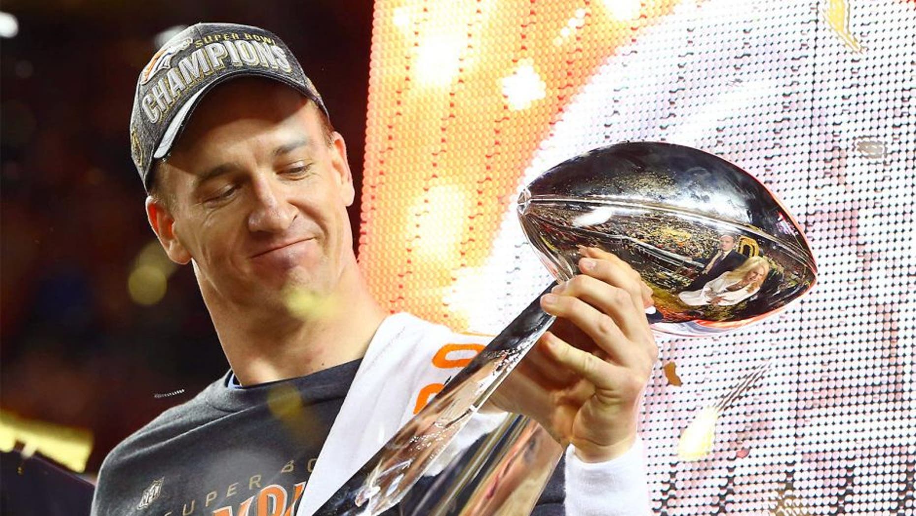 Feb 7, 2016; Santa Clara, CA, USA; Denver Broncos quarterback Peyton Manning (18) hoists the Vince Lombardi Trophy after defeating the Carolina Panthers in Super Bowl 50 at Levi's Stadium. Mandatory Credit: Mark J. Rebilas-USA TODAY Sports