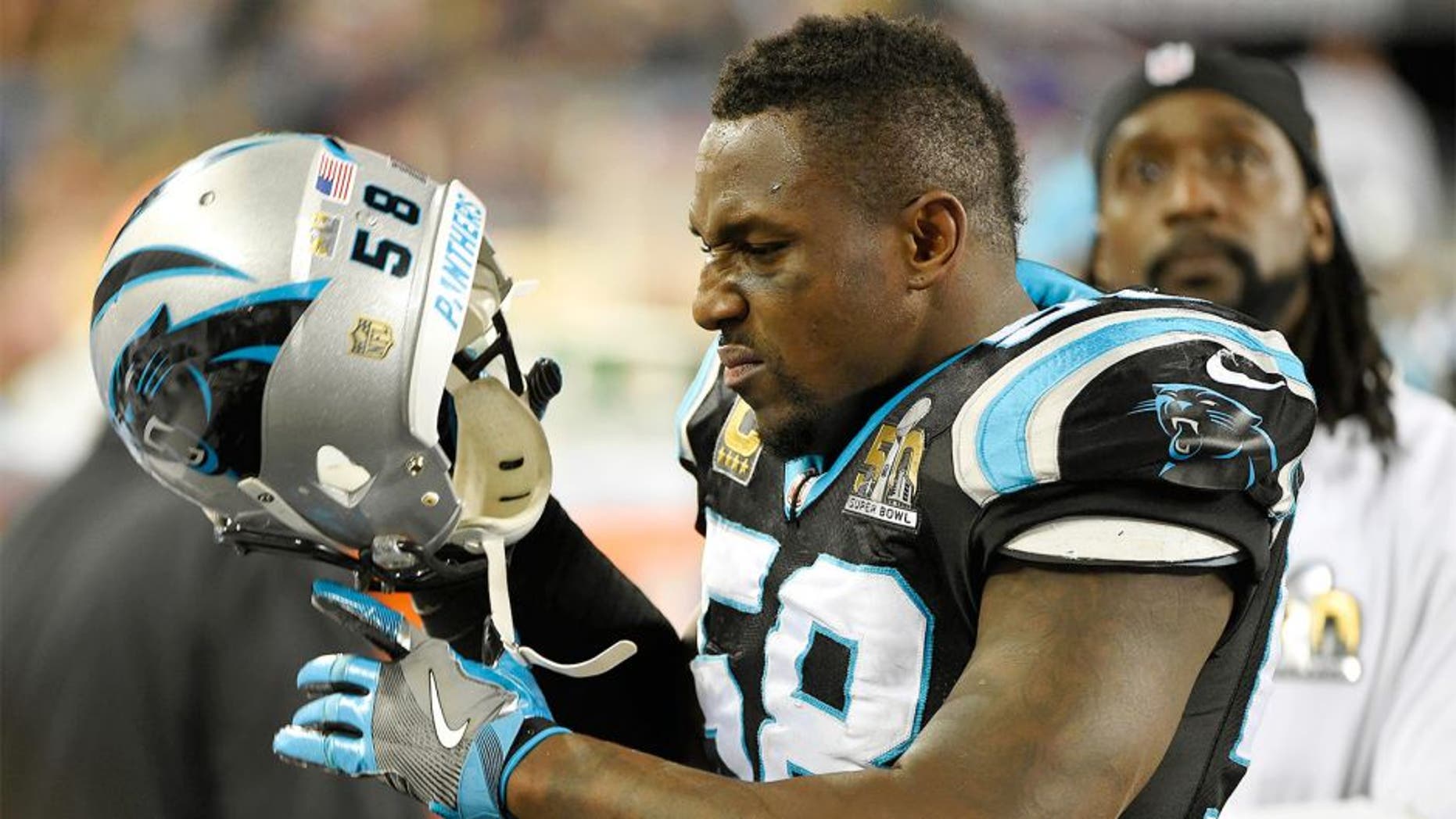 Carolina Panthers outside linebacker Thomas Davis (58) pulls his helmet off as injured cornerback Charles Tillman watches the video screen near the end of a 24-10 loss to the Denver Broncos in Super Bowl 50 at Levi's Stadium in Santa Clara, Calif., on Sunday, Feb. 7, 2016. (David T. Foster III/Charlotte Observer/TNS via Getty Images)