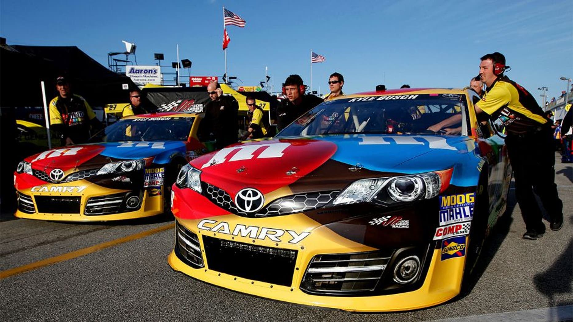 DAYTONA BEACH, FL - FEBRUARY 15: The #18 car driven by Kyle Busch is put into the garage before practice for the NASCAR Sprint Cup Series Sprint Unlimited at Daytona International Speedway on February 15, 2013 in Daytona Beach, Florida. (Photo by Nick Laham/Getty Images)