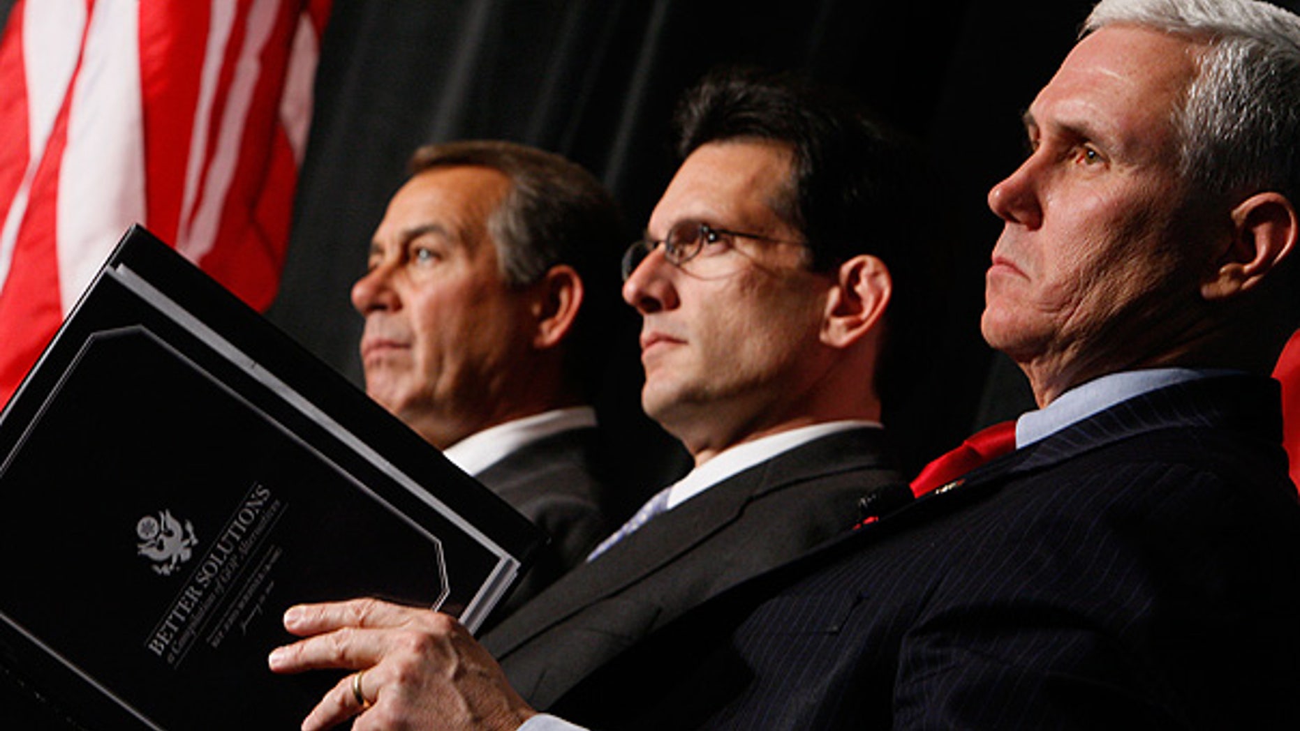 Jan. 29: House Minority Leader John Boehner, left, House Minority Whip Eric Cantor, center, and Rep. Mike Pence listen as President Obama speaks to Republican lawmakers.