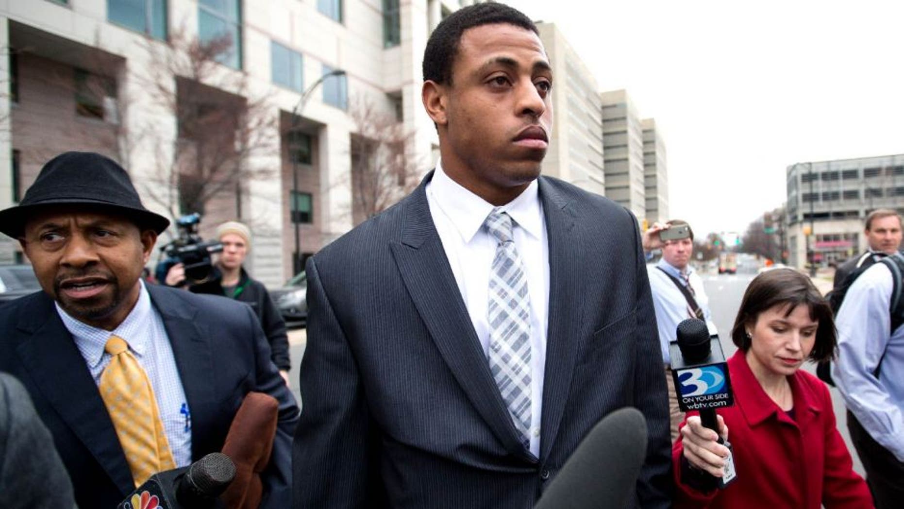 Carolina Panthers' Greg Hardy leaves the Mecklenburg County Courthouse after his domestic violence charges were dismissed in Charlotte, N.C., Monday, Feb. 9, 2015. (AP Photo/Chris Keane)