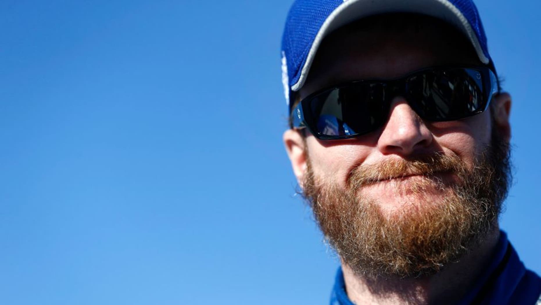 MARTINSVILLE, VA - OCTOBER 30: Dale Earnhardt Jr., driver of the #88 Nationwide Chevrolet, stands on the grid during qualifying for the NASCAR Sprint Cup Series Goody's Headache Relief Shot 500 at Martinsville Speedway on October 30, 2015 in Martinsville, Virginia. (Photo by Jeff Zelevansky/Getty Images)