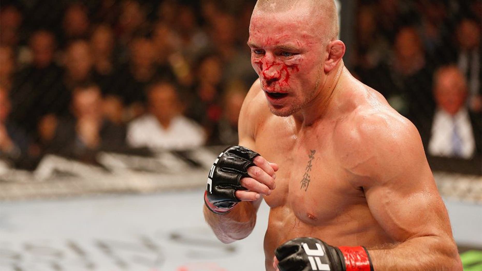 LAS VEGAS, NV - NOVEMBER 16: Georges St-Pierre stands in the Octagon during his UFC welterweight championship bout against Johny Hendricks during the UFC 167 event inside the MGM Grand Garden Arena on November 16, 2013 in Las Vegas, Nevada. (Photo by Josh Hedges/Zuffa LLC/Zuffa LLC via Getty Images) *** Local Caption *** Georges St-Pierre