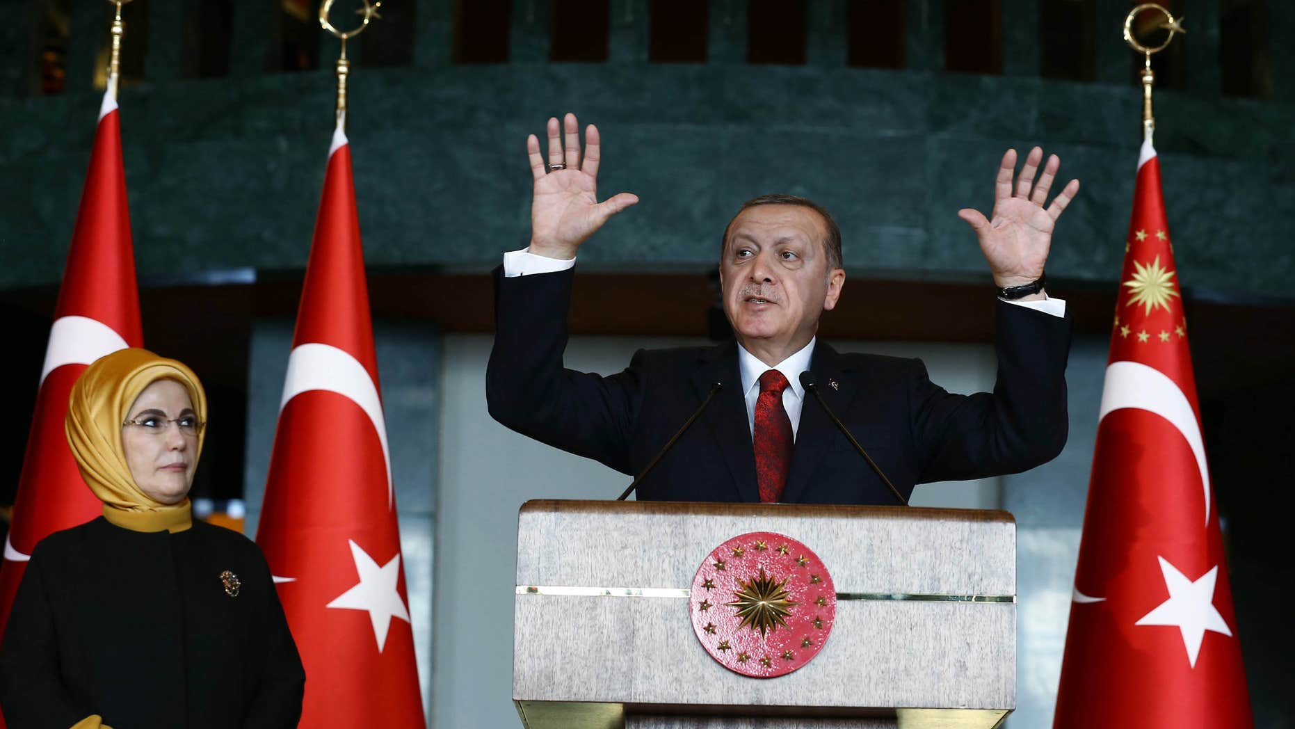 Feb. 9, 2016: Turkish President Recep Tayyip Erdogan, right, addresses a reception next to his wife Emine Erdogan at his palace in Ankara, Turkey.