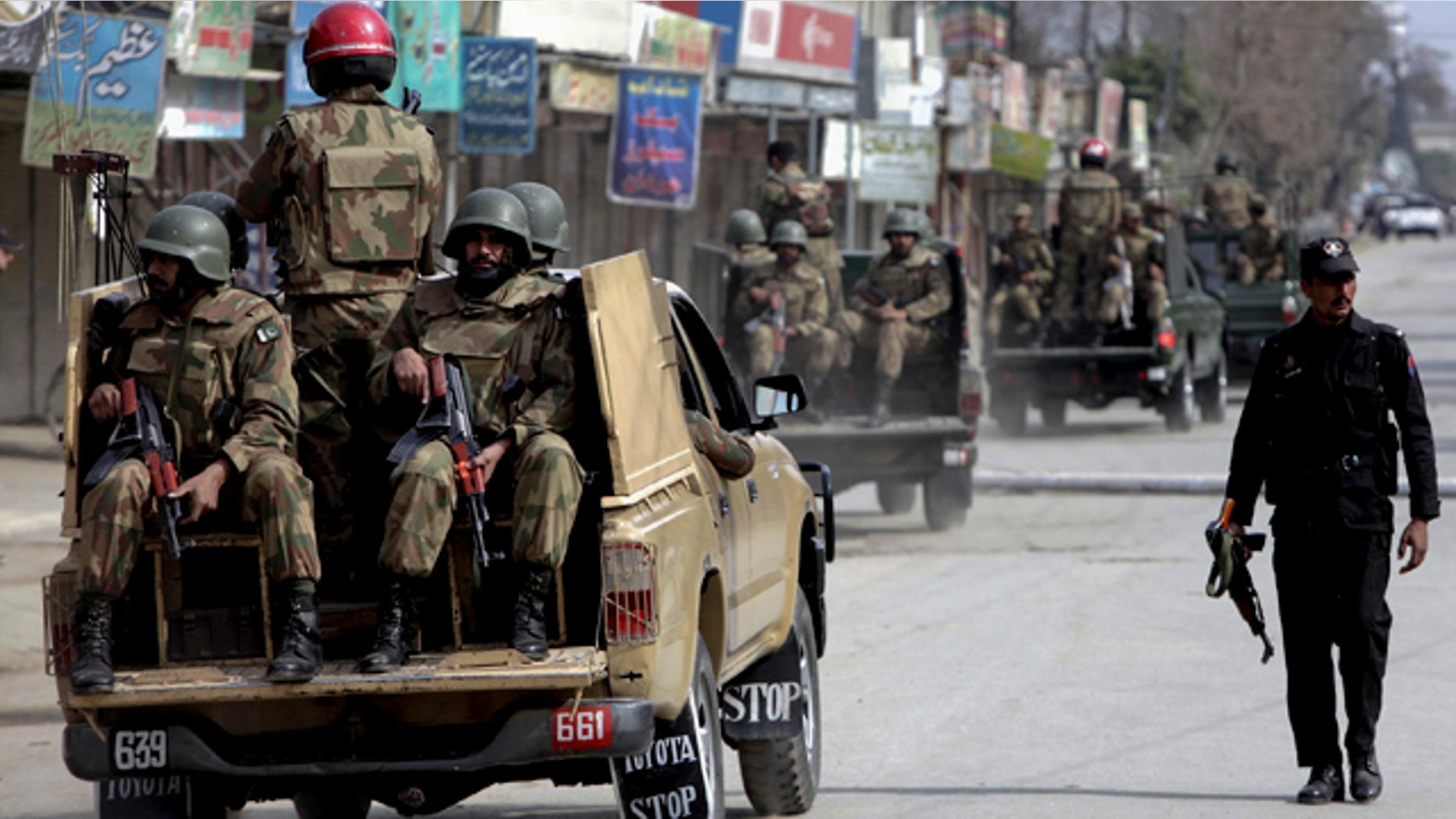 Feb. 10: Pakistan army soldiers patrol in the vicinity of the army training camp in Mardan near Peshawar, Pakistan.