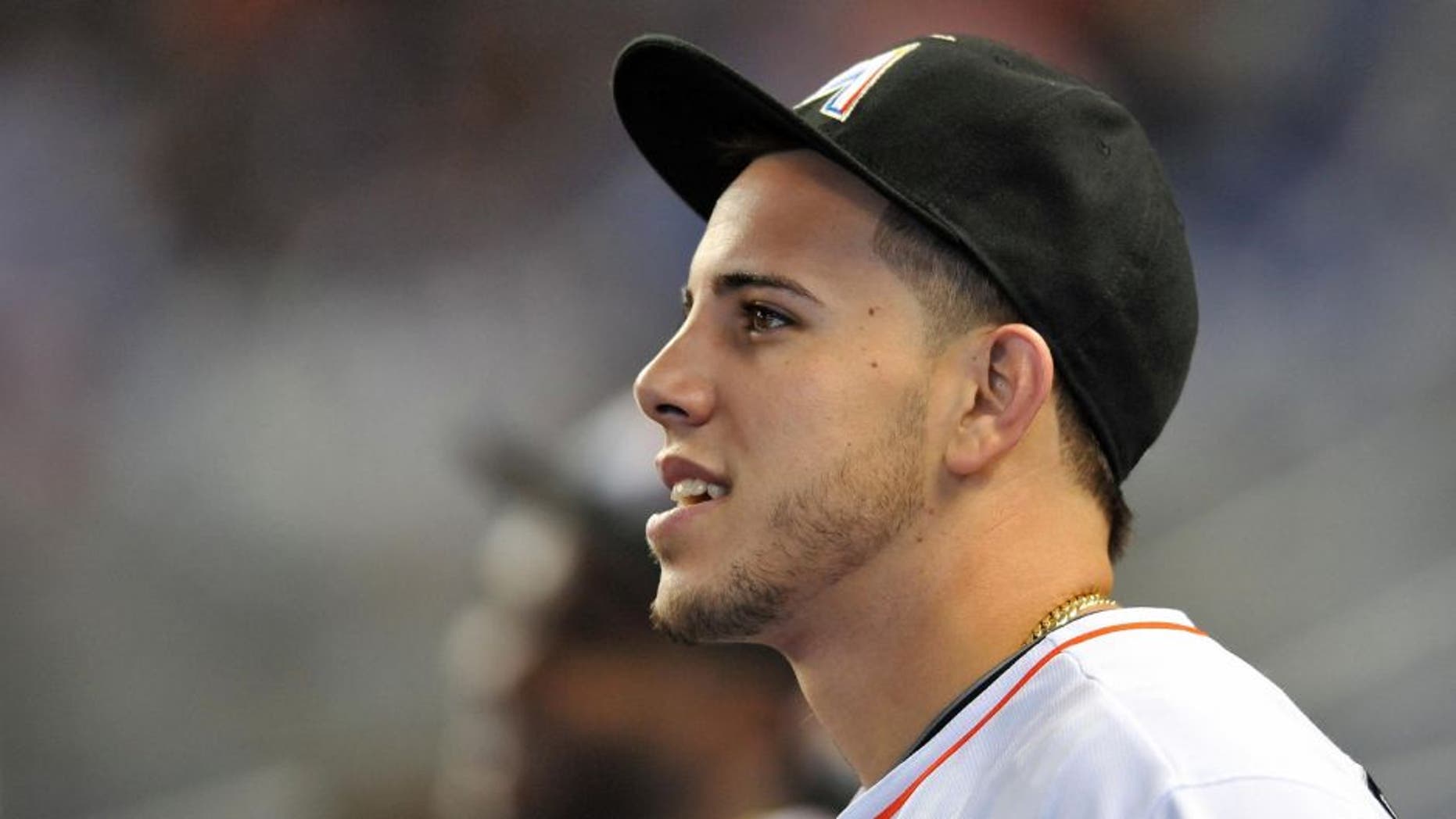 Sep 29, 2013; Miami, FL, USA; Miami Marlins starting pitcher Jose Fernandez (16) looks on from the dugout before a game against the Detroit Tigers at Marlins Ballpark. The Marlins won 1-0. Mandatory Credit: Steve Mitchell-USA TODAY Sports
