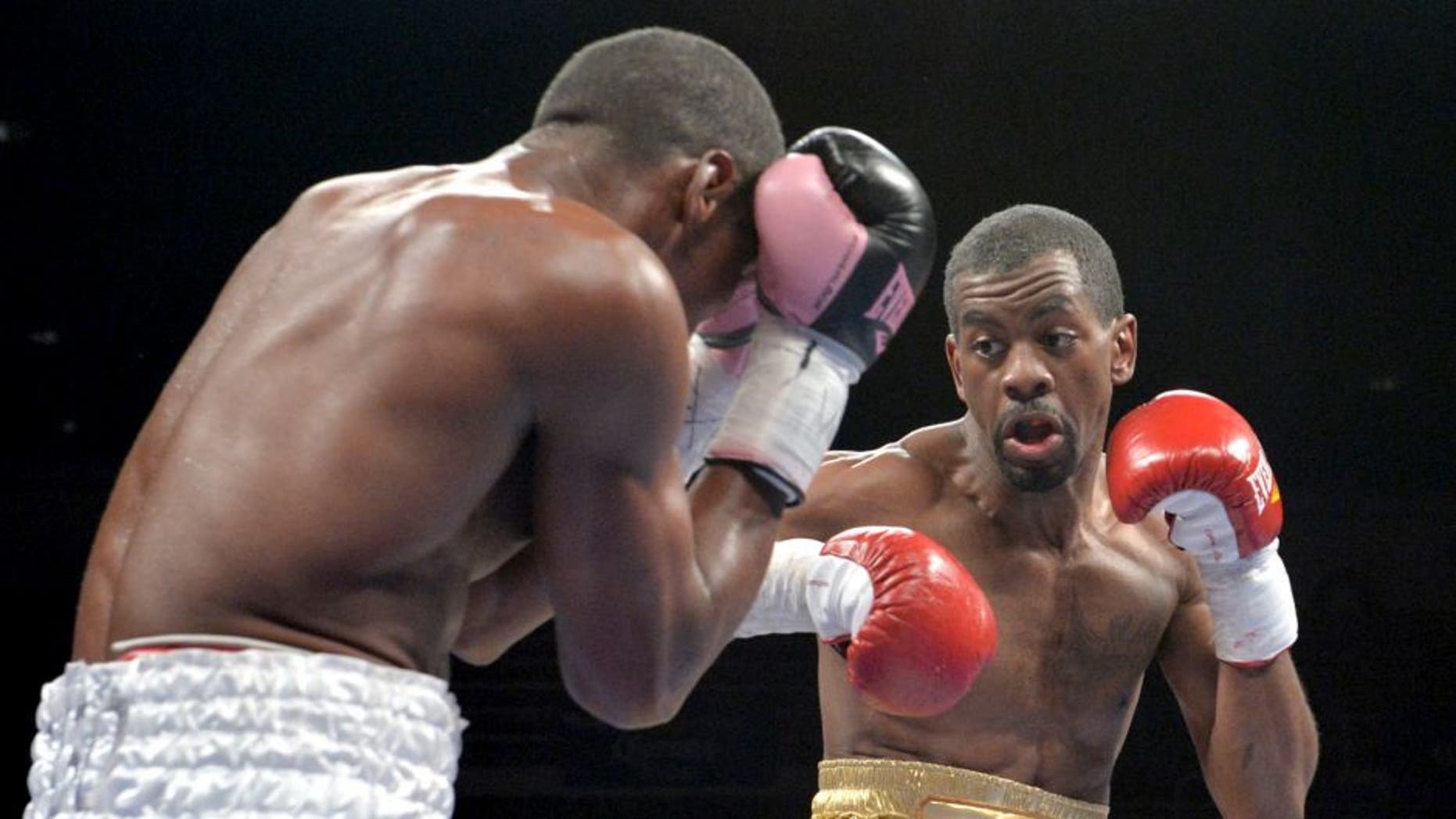 Antonio Sanchez (L) of Bayamon, Puerto Rico, defends against Jamel Herring (R) of Coram, NY, USA, during their lightweight preliminary match at the DC Armory on January 25, 2014 in Washington, DC, ahead of the IBF Jr. welterweight title match between Lamont Peterson and Dierry Jean. Herring won a 6-round split decision. AFP PHOTO / Nicholas KAMM (Photo credit should read NICHOLAS KAMM/AFP/Getty Images)