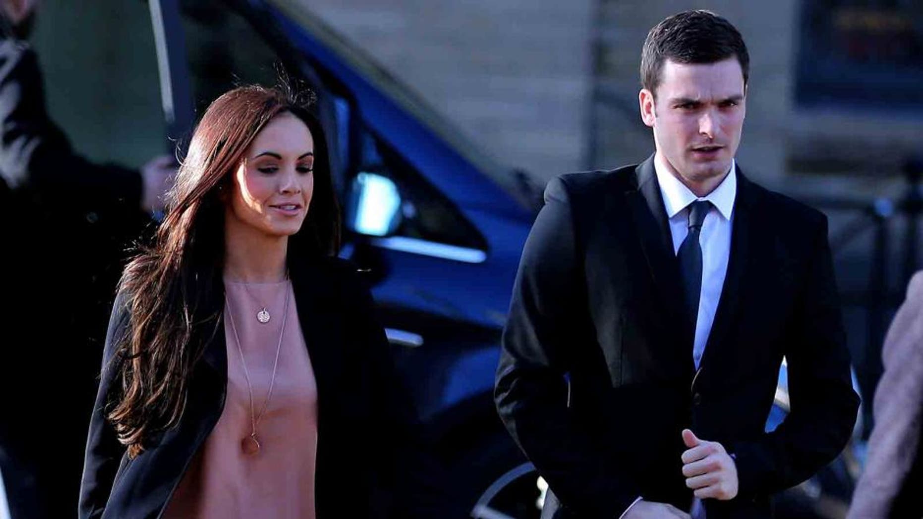 BRADFORD, ENGLAND - FEBRUARY 10: Adam Johnson arrives with girlfriend Stacey Flounders at the Crown Court on February 10, 2016 in Bradford, England. The Sunderland FC midfielder, aged 28 and from Castle Eden, County Durham, is on trial having previously denied three counts of sexual activity with a child and one count of grooming. He has one daughter. (Photo by Nigel Roddis/Getty Images)