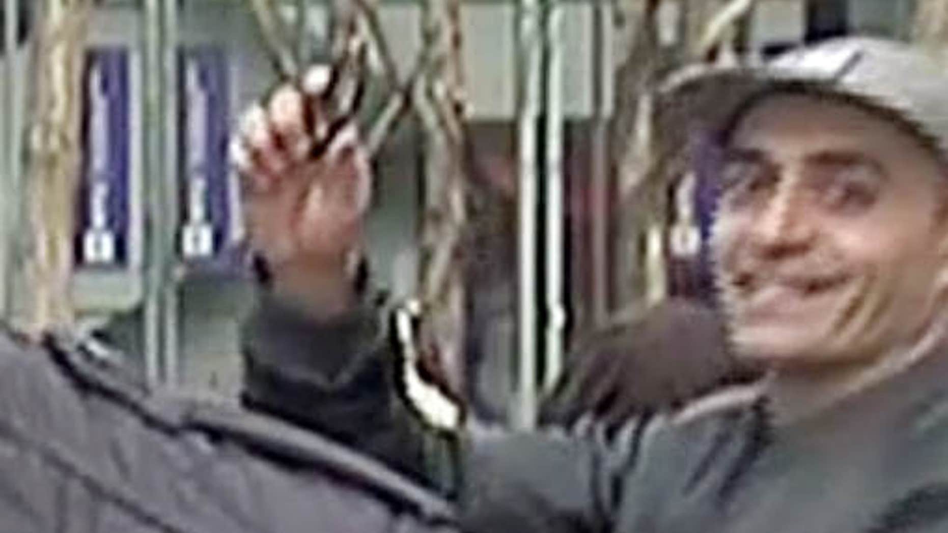 Feb. 10, 2016: In this image taken from WNBC-TV video, a man appears to wave a handgun behind a television news reporter during a live broadcast in New York City