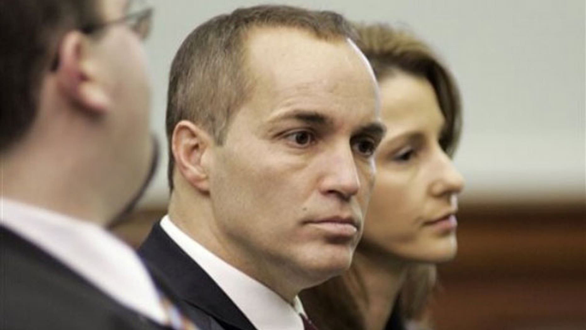 Feb. 5: Former aide to John Edwards Andrew Young, left, and his wife Cheri Young wait for a court hearing to begin over a "private" videotape authored by the candidate's mistress, at the Chatham County in Pittsboro, N.C. (AP).