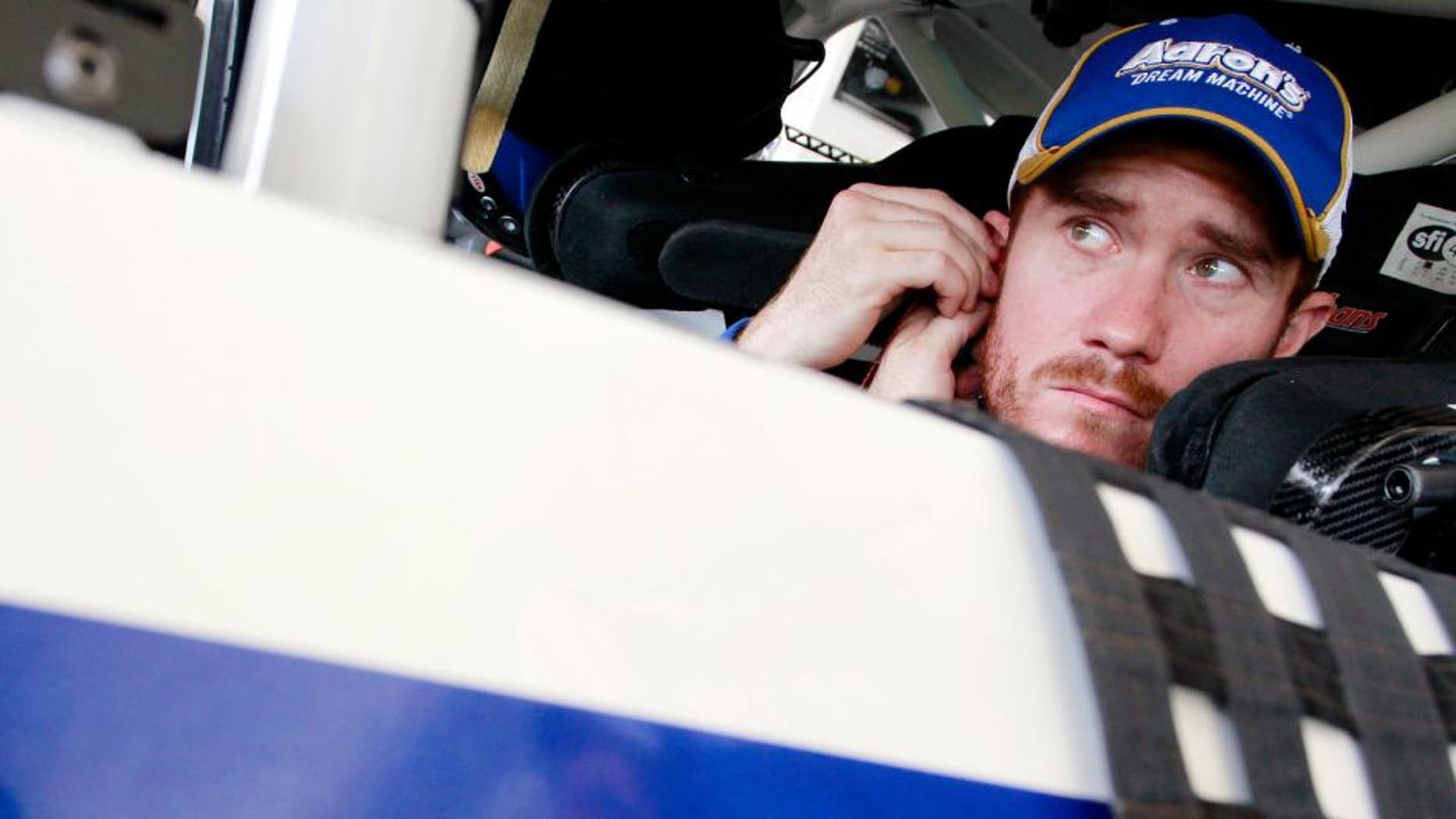 HOMESTEAD, FL - NOVEMBER 15: Brian Vickers, driver of the #55 Aaron's Dream Machine Toyota, sits in his car in the garage area during practice for the NASCAR Sprint Cup Series Ford EcoBoost 400 at Homestead-Miami Speedway on November 15, 2014 in Homestead, Florida. (Photo by Brian Lawdermilk/Getty Images)
