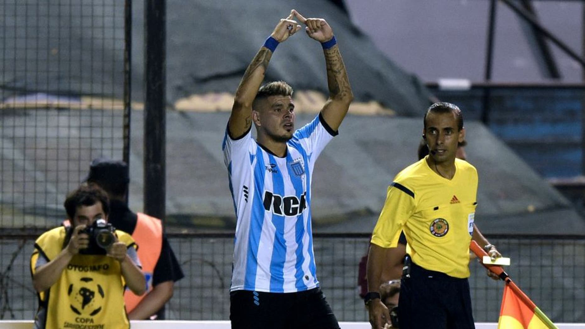 Argentina's Racing Club forward Gustavo Bou (C) celebrates after scoring a goal against Mexico's Puebla during the Copa Libertadores 2016 football match at Juan Domingo Peron stadium in Avellaneda, Buenos Aires, Argentina, on February 10, 2016. AFP PHOTO / JUAN MABROMATA / AFP / JUAN MABROMATA (Photo credit should read JUAN MABROMATA/AFP/Getty Images)