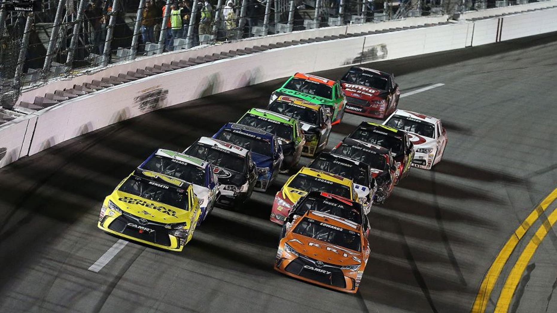 DAYTONA BEACH, FL - FEBRUARY 14: Matt Kenseth, driver of the #20 Dollar General Toyota, and Carl Edwards, driver of the #19 Arris Toyota, during the 3rd Annual Sprint Unlimited at Daytona at Daytona International Speedway on February 14, 2015 in Daytona Beach, Florida. (Photo by Patrick Smith/NASCAR via Getty Images)