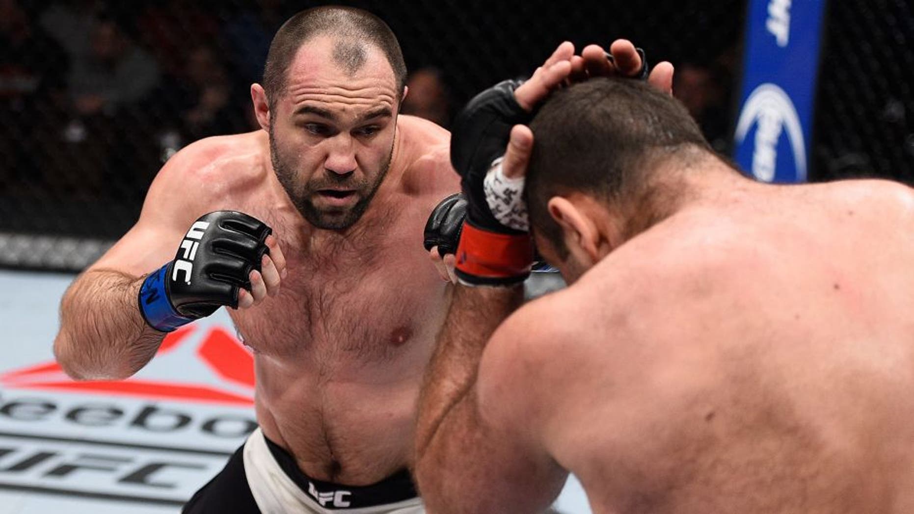 LAS VEGAS, NV - DECEMBER 11: (L-R) Konstantin Erokhin punches Gabriel Gonzaga in their heavyweight bout during the TUF Finale event inside The Chelsea at The Cosmopolitan of Las Vegas on December 11, 2015 in Las Vegas, Nevada. (Photo by Jeff Bottari/Zuffa LLC/Zuffa LLC via Getty Images)