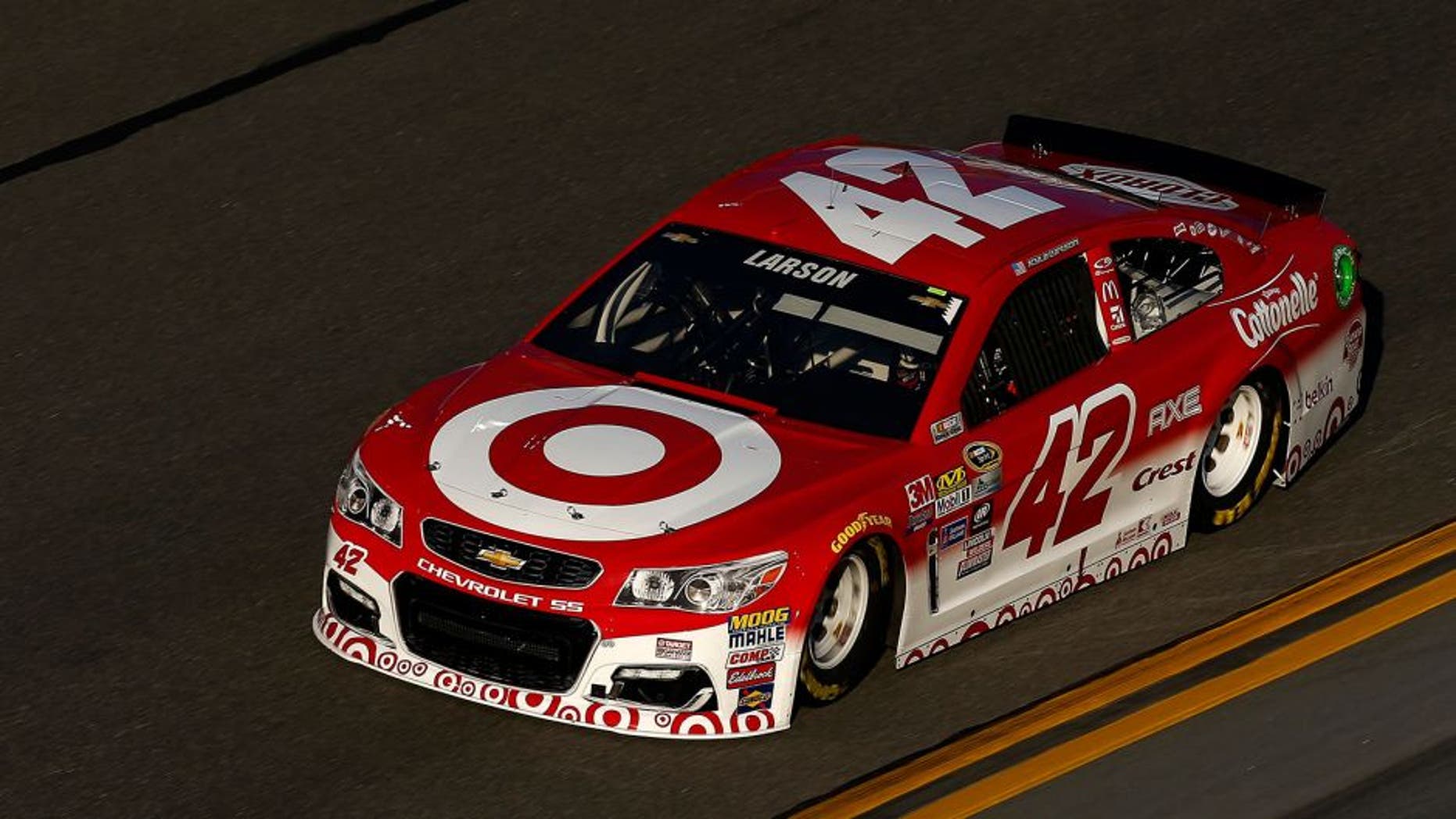 DAYTONA BEACH, FL - FEBRUARY 12: Kyle Larson, driver of the #42 Target Chevrolet, stands in the garage area during practice for the NASCAR Sprint Cup Series Sprint Unlimited at Daytona International Speedway on February 12, 2016 in Daytona Beach, Florida. (Photo by Jonathan Ferrey/NASCAR via Getty Images)