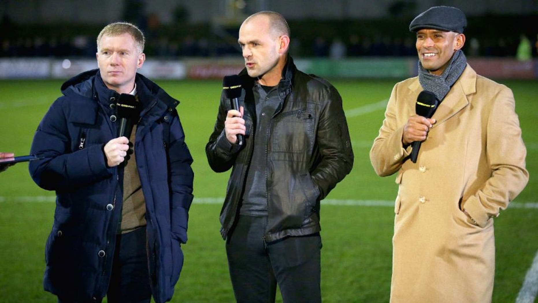 SALFORD, ENGLAND - DECEMBER 04: The BBC pundits (L-R) Paul Scholes, part owner of Salford City and former players Danny Murphy and Trevor Sinclair talk prior to the Emirates FA Cup Second Round match between Salford City and Hartlepool United at Moor Lane on December 4, 2015 in Salford, England. (Photo by Alex Livesey/Getty Images)