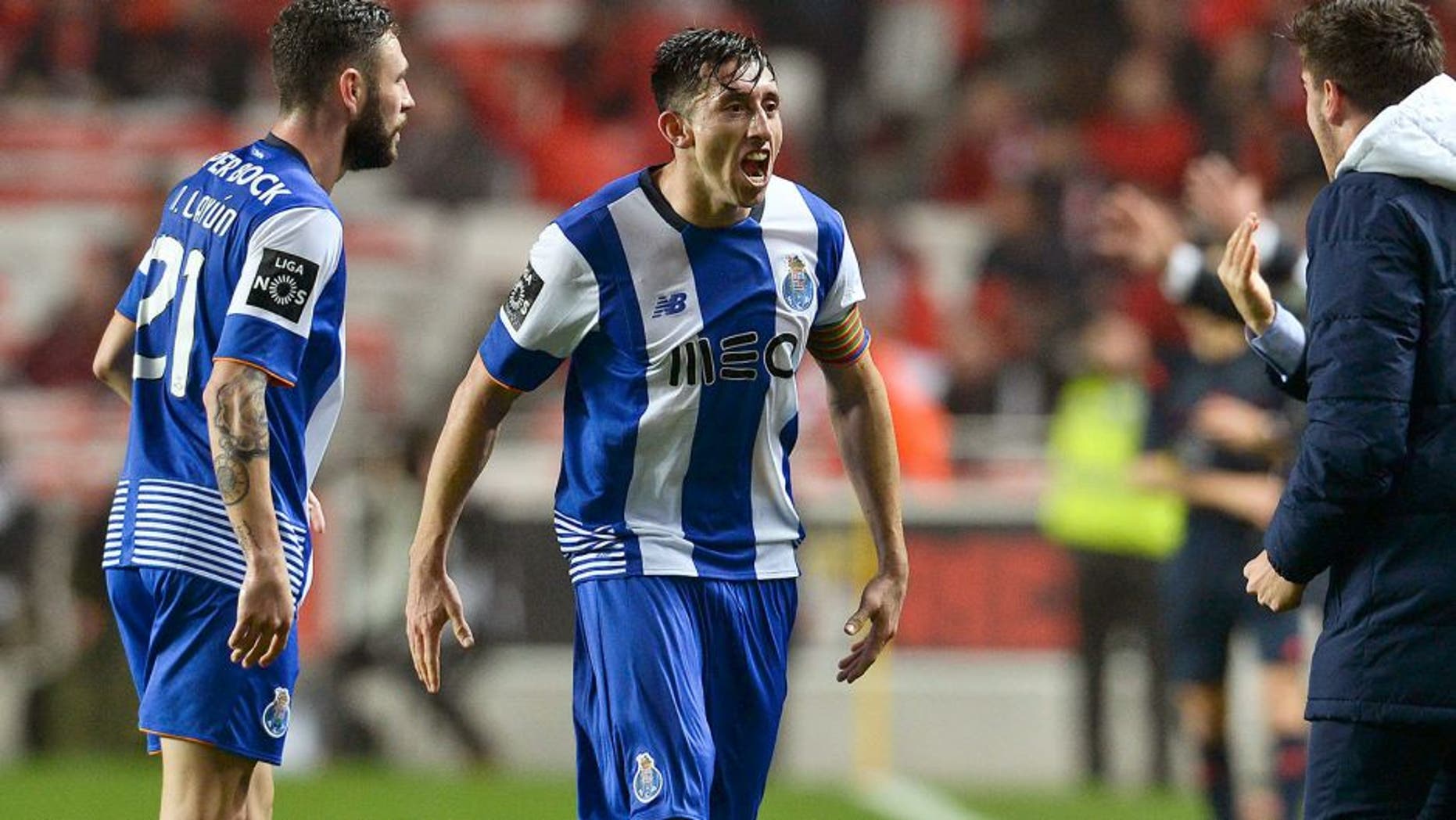 Porto's Mexican midfielder Hector Herrera (2nd L) celebrates a goal with teammate Porto's Mexican defender Miguel Layun (L) during the Portuguese league football match SL Benfica vs FC Porto at the Luz stadium in Lisbon on February 12, 2016. / AFP / PATRICIA DE MELO MOREIRA (Photo credit should read PATRICIA DE MELO MOREIRA/AFP/Getty Images)