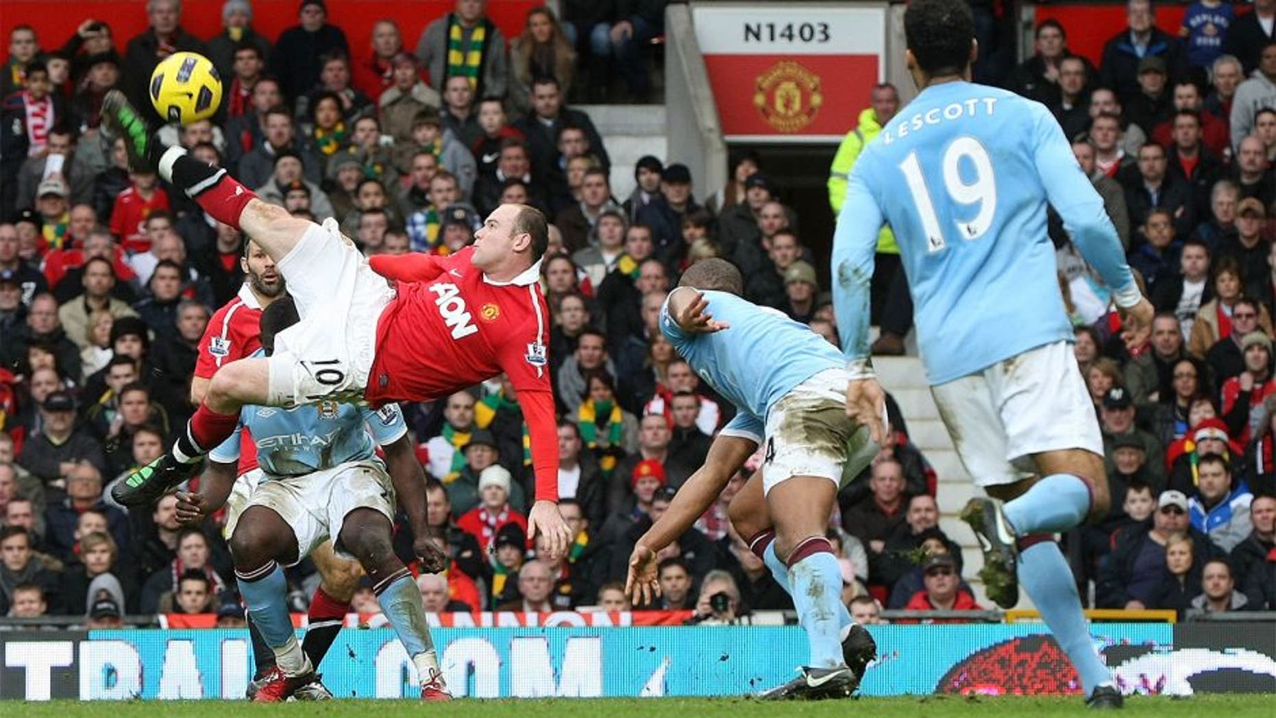 MANCHESTER, ENGLAND - FEBRUARY 12: Wayne Rooney of Manchester United scores their second goal during the Barclays Premier League match between Manchester United and Manchester City at Old Trafford on February 12, 2011 in Manchester, England. (Photo by Matthew Peters/Man Utd via Getty Images) *** Local Caption *** Wayne Rooney
