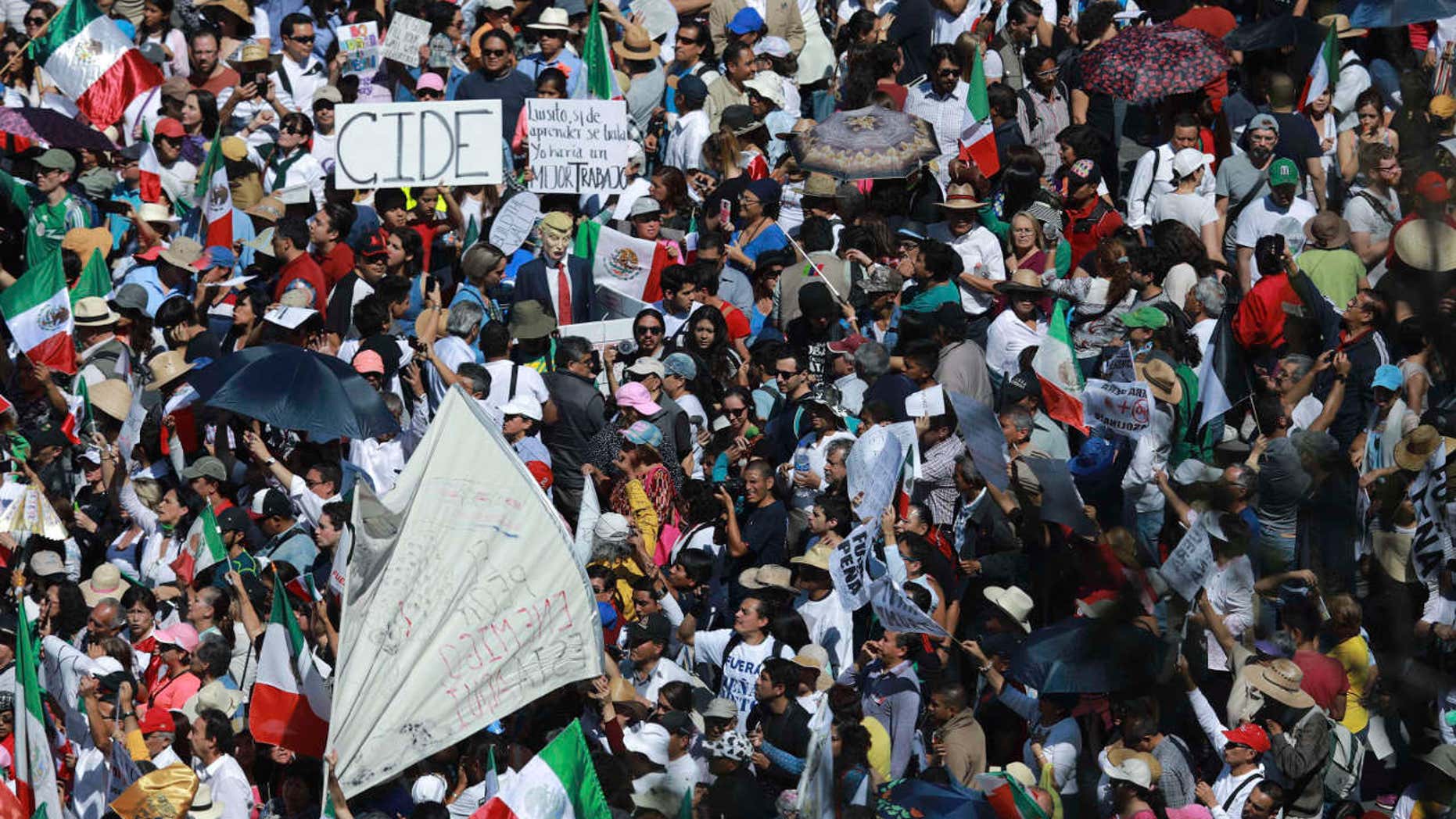 Feb. 12, 2017: Demonstrators march demanding respect for Mexico and its migrants, in the face of perceived hostility from the administration of U.S. President Donald Trump, in Mexico City.