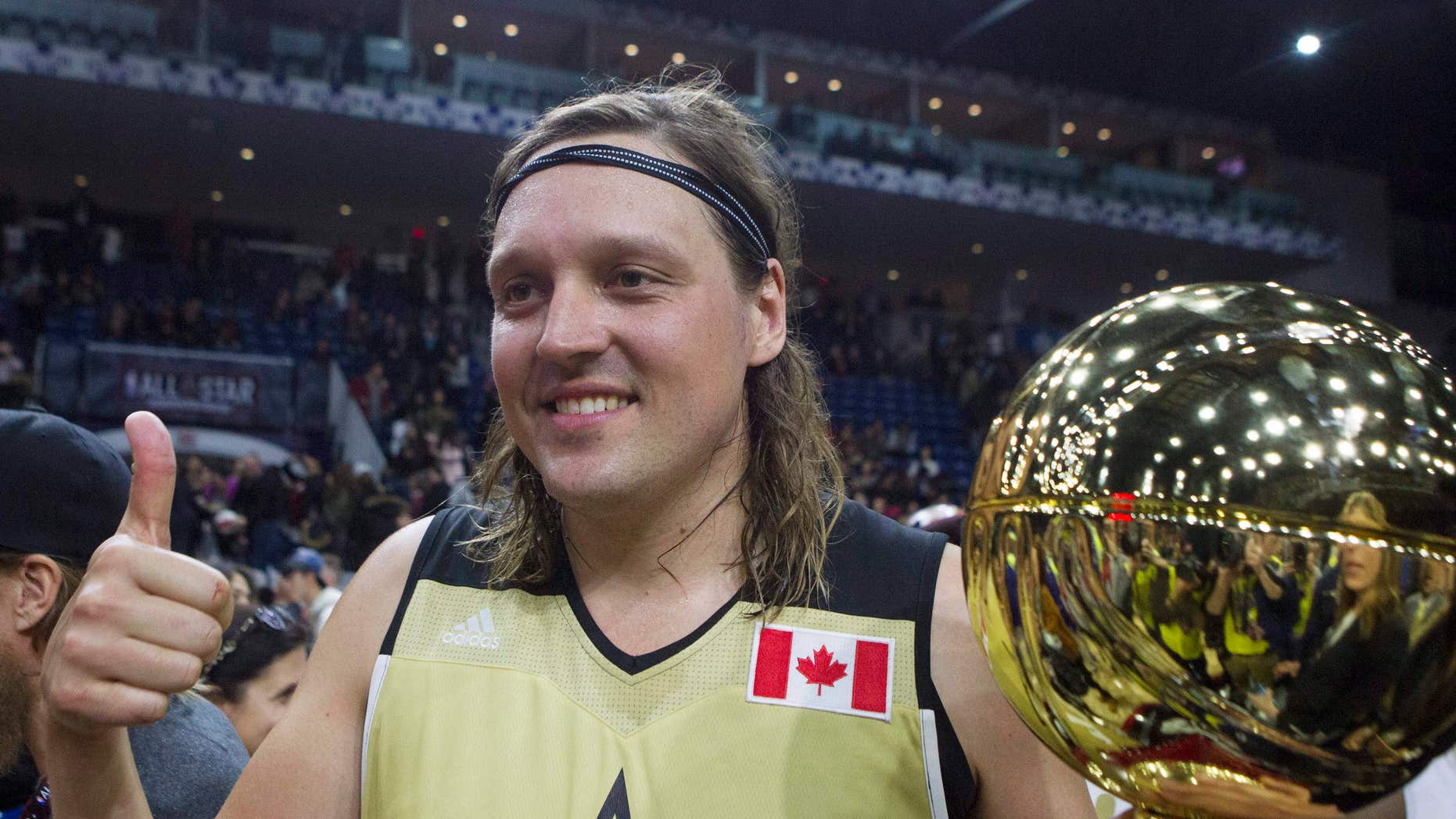 Feb. 12, 2016: Canada's Win Butler. of Arcade Fire, holds the MVP trophy after Canada defeated the United States in the Celebrity Game, part of NBA basketball's All-Star weekend, in Toronto.