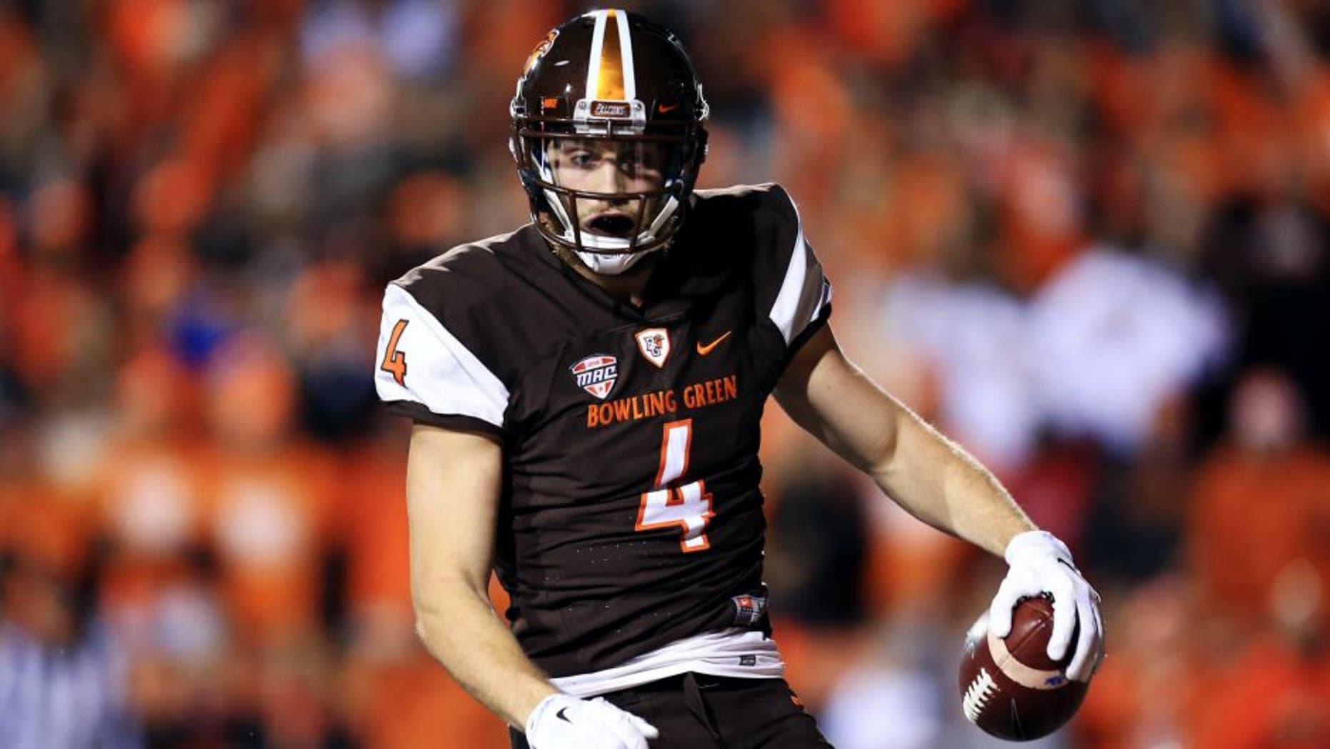 TOLEDO, OH - NOVEMBER 17: Wide receiver Gehrig Dieter #4 of the Bowling Green Falcons celebrates after catching a pass for a touchdown during the fourth quarter against the Toledo Rockets at Doyt Perry Stadium on November 17, 2015 in Bowling Green, Ohio. Toledo defeated Bowling Green 44-28. (Photo by Andrew Weber/Getty Images)