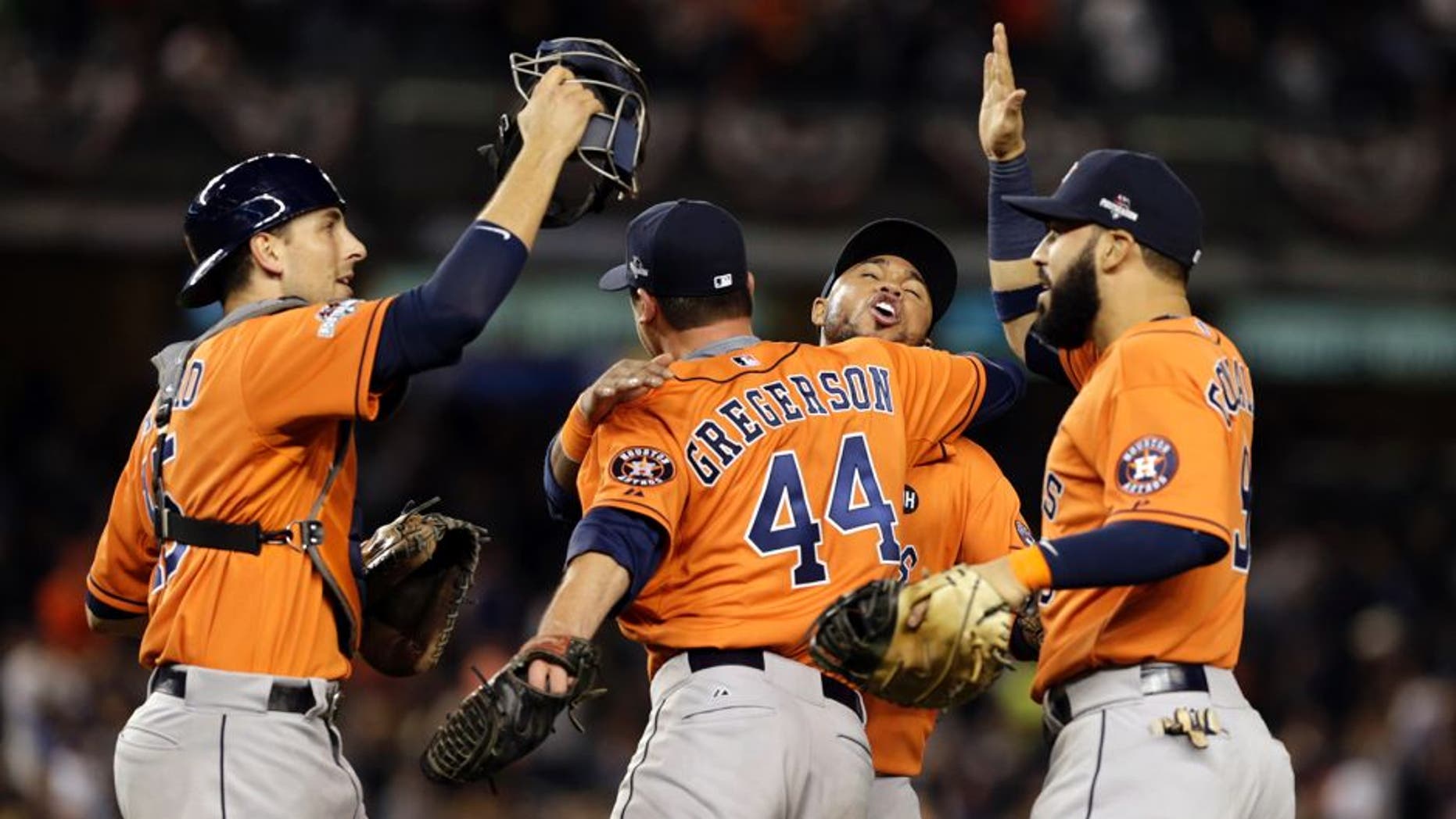 Oct 6, 2015; Bronx, NY, USA; Houston Astros relief pitcher Luke Gregerson (44) celebrates with teammates after defeating the New York Yankees in the American League Wild Card playoff baseball game at Yankee Stadium. Houston won 3-0. Mandatory Credit: Adam Hunger-USA TODAY Sports
