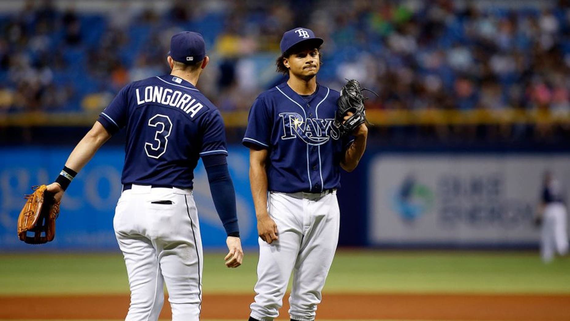 ST. PETERSBURG, FL - OCTOBER 3: Third baseman Evan Longoria #3 of the Tampa Bay Rays comes out to the mound to speak to pitcher Chris Archer #22 of the Tampa Bay Rays after Jose Bautista #19 of the Toronto Blue Jays hit an RBI single to score Cliff Pennington #9 during the third inning of a game on October 3, 2015 at Tropicana Field in St. Petersburg, Florida. (Photo by Brian Blanco/Getty Images)
