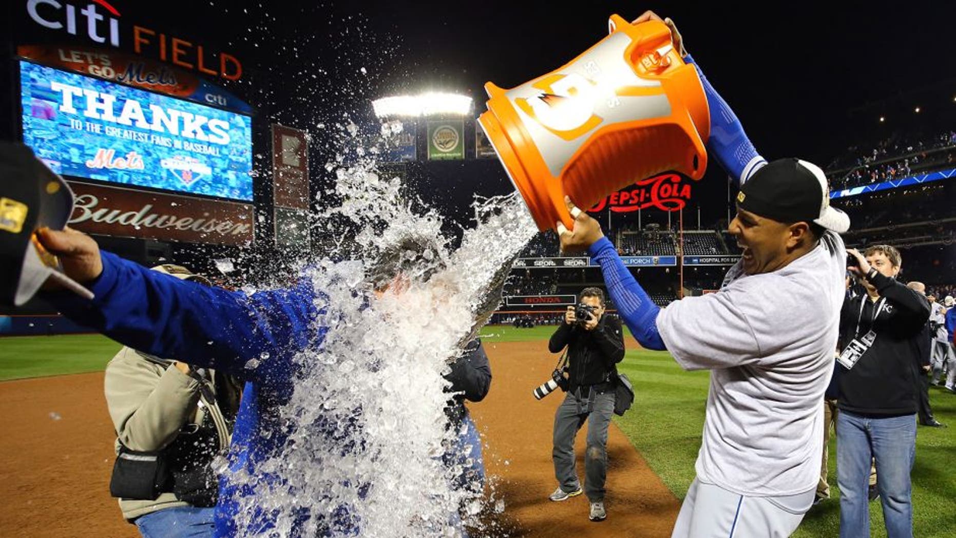 NEW YORK, NY - NOVEMBER 01: Salvador Perez #13 of the Kansas City Royals douses manager Ned Yost #3 of the Kansas City Royals after defeating the New York Mets in Game Five of the 2015 World Series at Citi Field on November 1, 2015 in the Flushing neighborhood of the Queens borough of New York City. The Kansas City Royals defeated the New York Mets with a score of 7 to 2 to win the World Series. (Photo by Al Bello/Getty Images)