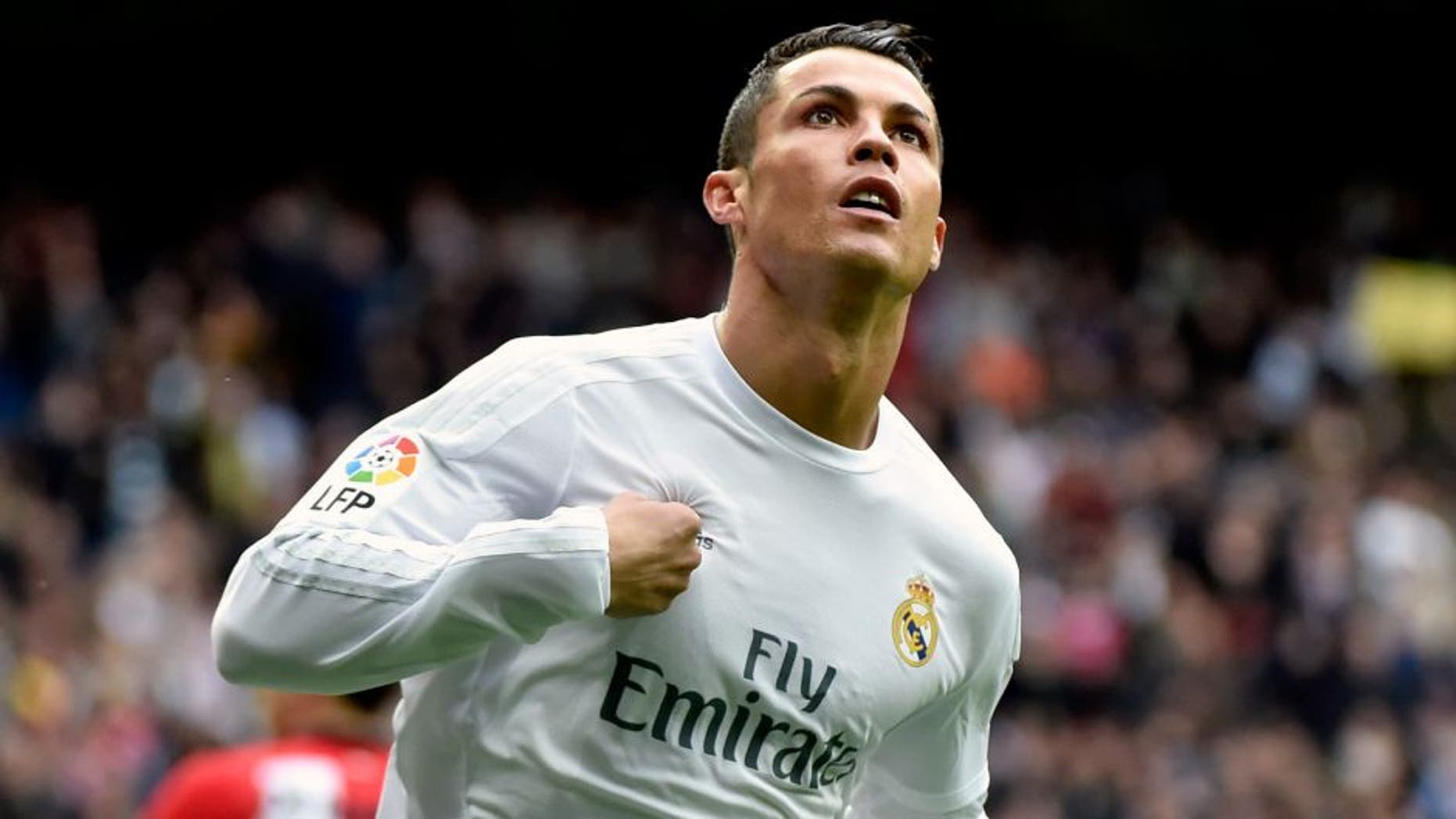 Real Madrid's Portuguese forward Cristiano Ronaldo celebrates after scoring during the Spanish league football match Real Madrid CF vs Athletic Club Bilbao at the Santiago Bernabeu stadium in Madrid on February 13, 2016. / AFP / GERARD JULIEN (Photo credit should read GERARD JULIEN/AFP/Getty Images)