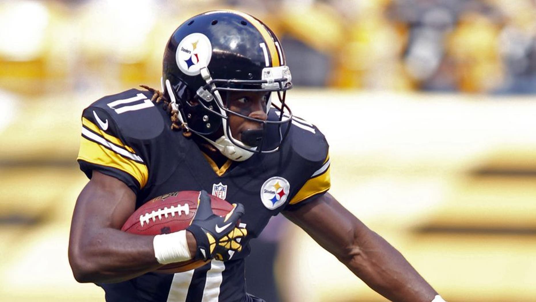 Sep 8, 2013; Pittsburgh, PA, USA; Pittsburgh Steelers wide receiver Markus Wheaton (11) returns a kick-off against the Tennessee Titans during the fourth quarter at Heinz Field. The Tennessee Titans won 16-9. Mandatory Credit: Charles LeClaire-USA TODAY Sports