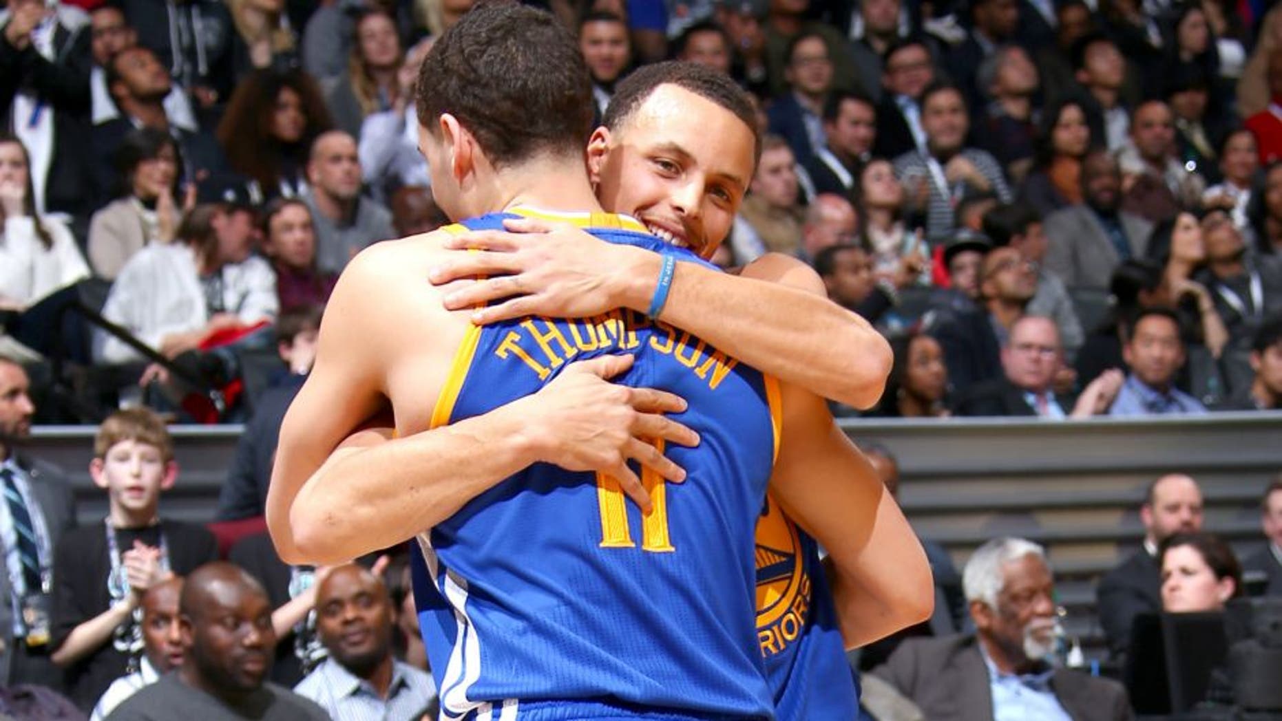 BROOKLYN, NY - FEBRUARY 14: Teammates Stephen Curry #30 and Klay Thompson #11 of the Golden State Warriors hug during the Foot Locker Three Point Contest on State Farm All-Star Saturday Night as part of the 2015 NBA All-Star Weekend on February 14, 2015 at Barclays Center in Brooklyn, New York. NOTE TO USER: User expressly acknowledges and agrees that, by downloading and/or using this photograph, user is consenting to the terms and conditions of the Getty Images License Agreement. Mandatory Copyright Notice: Copyright 2015 NBAE (Photo by Nathaniel S. Butler/NBAE via Getty Images)