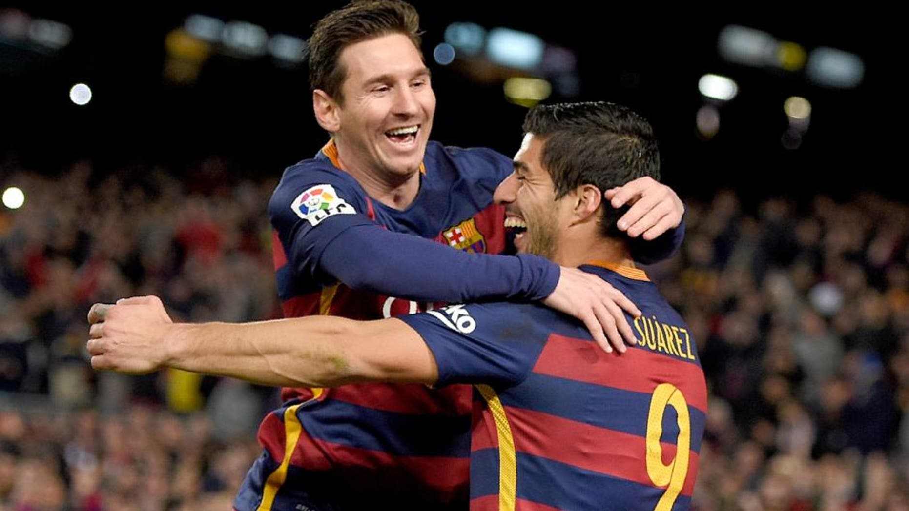 Barcelona's Uruguayan forward Luis Suarez (R) celebrates a goal with Barcelona's Argentinian forward Lionel Messi during the Spanish league football match FC Barcelona vs RC Celta de Vigo at the Camp Nou stadium in Barcelona on February 14, 2016. / AFP / LLUIS GENE (Photo credit should read LLUIS GENE/AFP/Getty Images)
