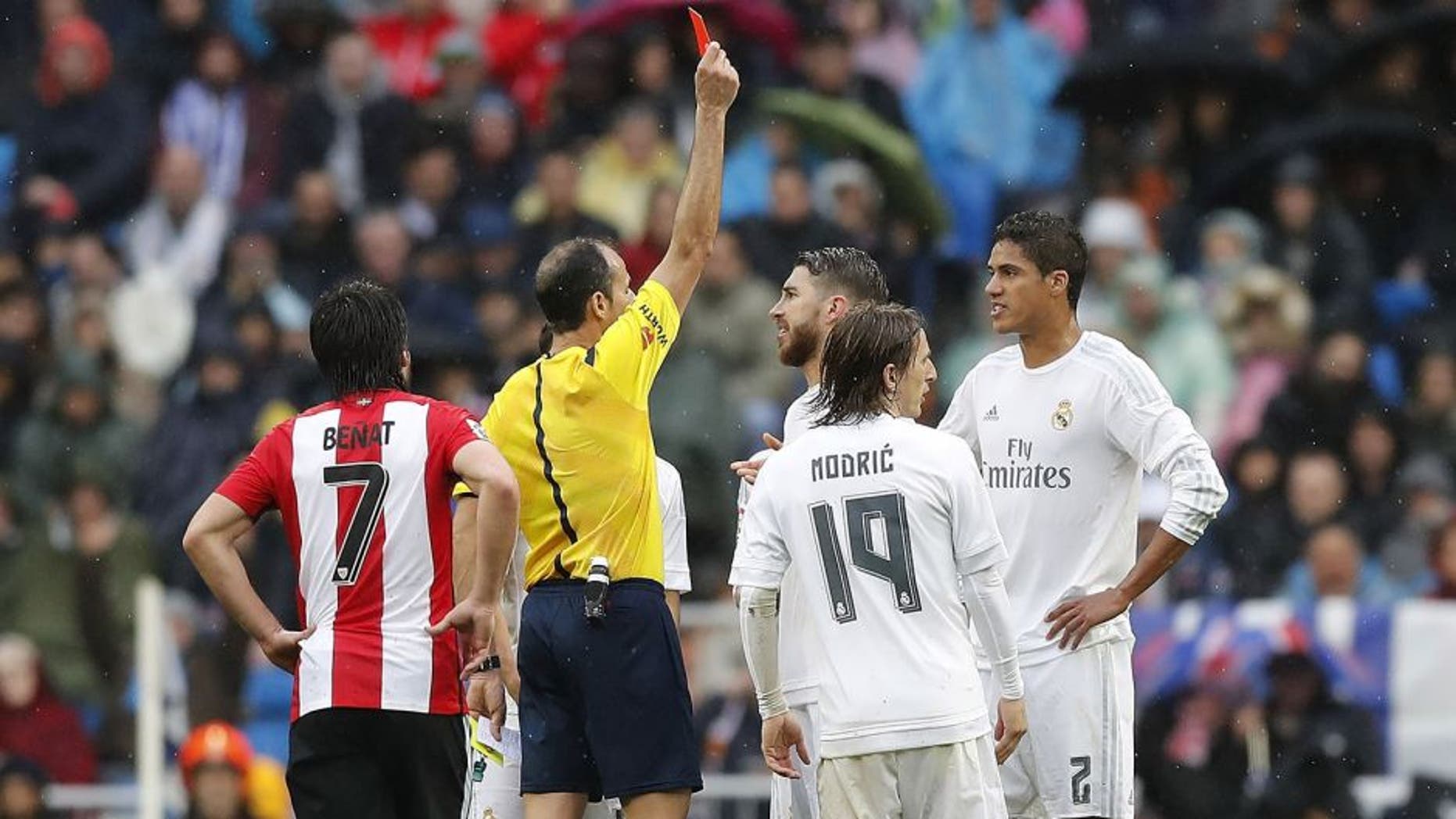 MADRID, SPAIN - FEBRUARY 13: Referee Alfonso Alvarez shows a red card to Raphael Varane of Real Madrid during the La Liga match between Real Madrid CF and Athletic Club at Estadio Santiago Bernabeu on February 13, 2016 in Madrid, Spain. (Photo by Angel Martinez/Real Madrid via Getty Images)