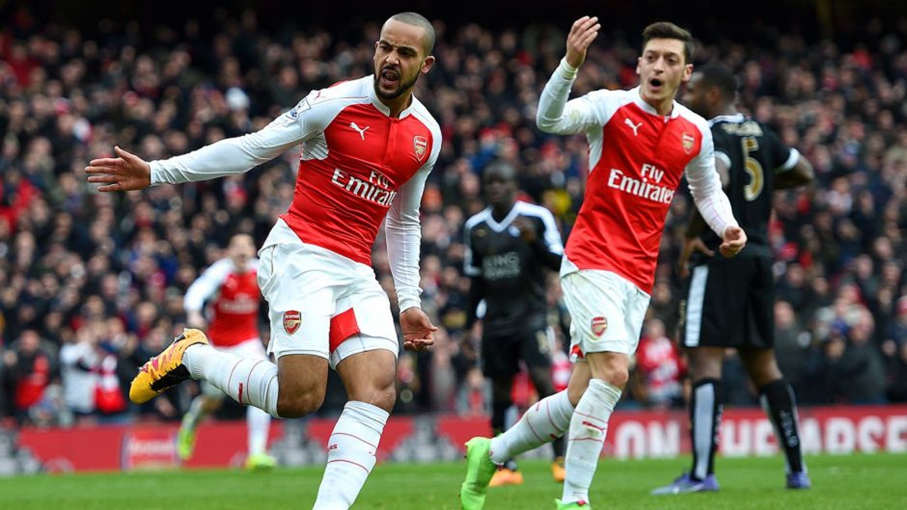 LONDON, ENGLAND - FEBRUARY 14: Theo Walcott of Arsenal celebrates after scoring his team's first goal during the Barclays Premier League match between Arsenal and Leicester City at Emirates Stadium on February 14, 2016 in London, England. (Photo by Ross Kinnaird/Getty Images)