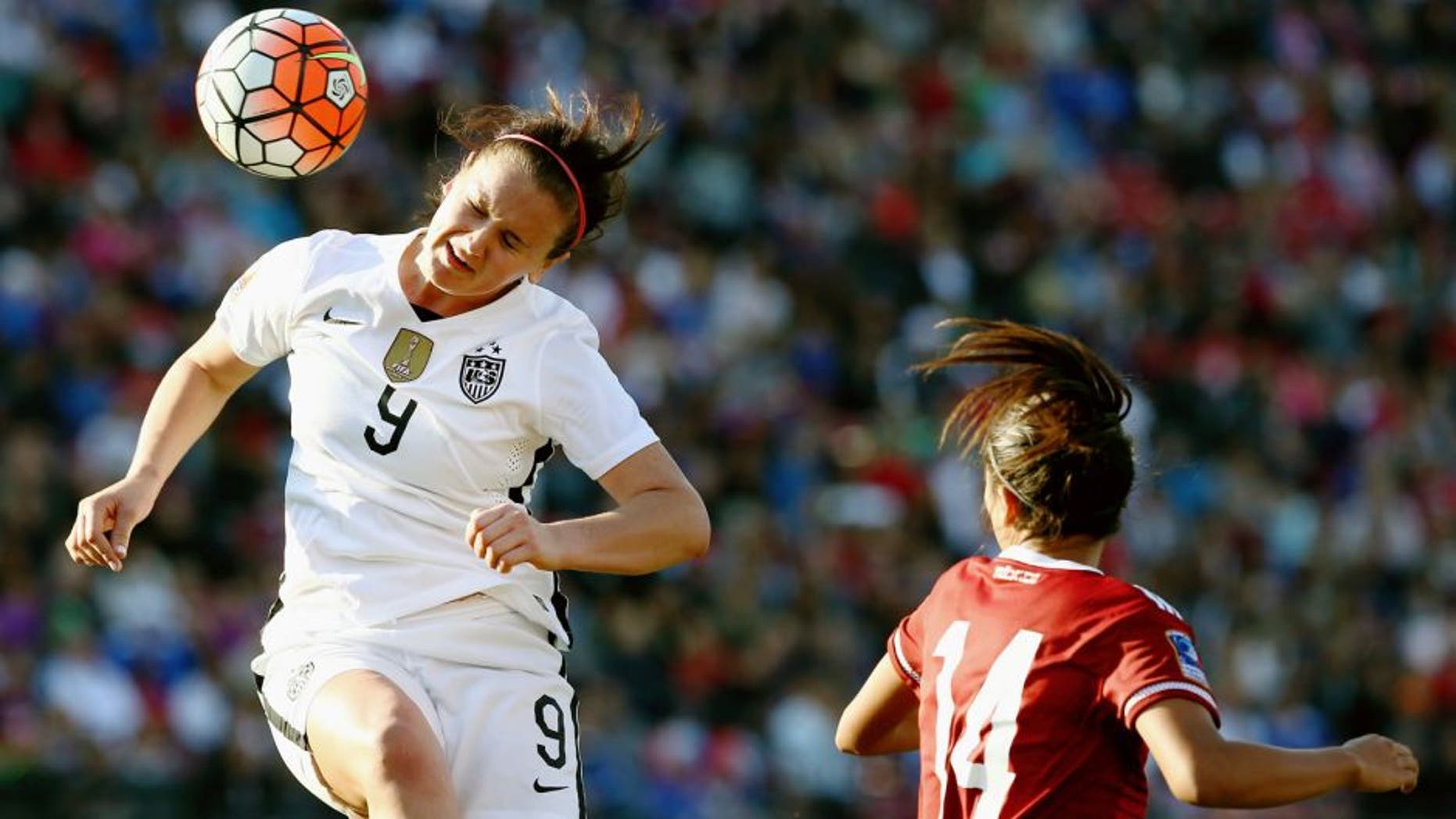 FRISCO, TX - FEBRUARY 13: Lindsey Horan #9 of USA heads the ball against Annia Mejia #14 of Mexico in the first half of the United States v Mexico: Group A - 2016 CONCACAF Women's Olympic Qualifying at Toyota Stadium on February 13, 2016 in Frisco, Texas. (Photo by Tom Pennington/Getty Images)