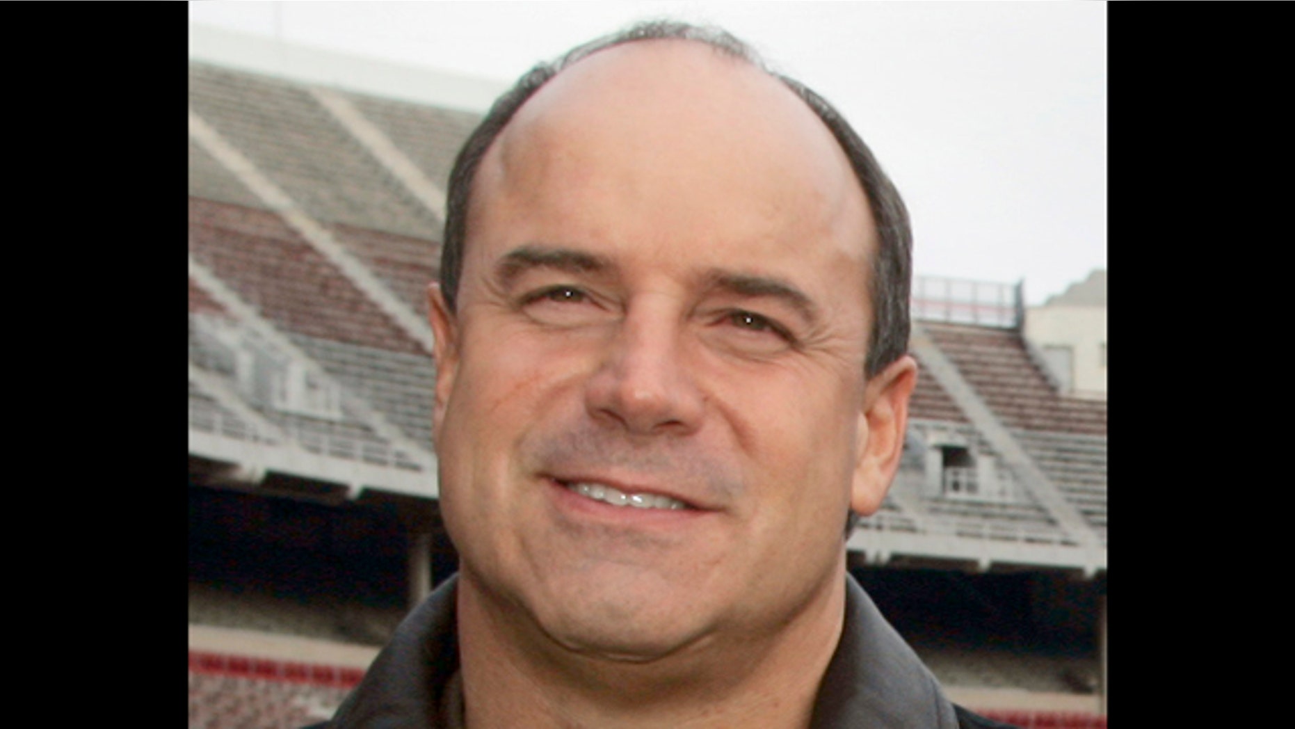 In a Dec. 2006 file photo, former Ohio State quarterback Art Schlichter stands at a stadium in Columbus, Ohio.