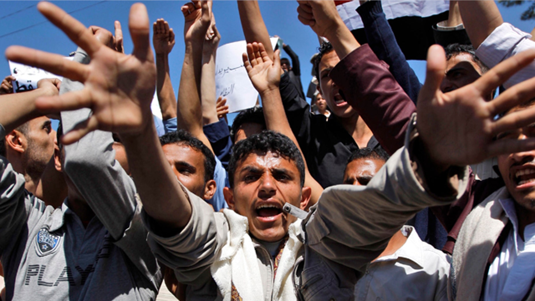 Feb. 14: Yemeni anti-government protestors shout slogans during a demonstration demanding political reform and the resignation of President Ali Abdullah Saleh in Sanaa, Yemen.