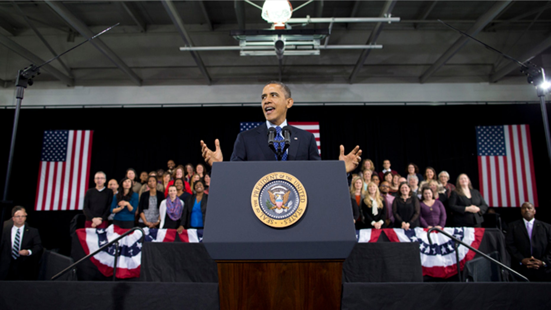 President Barack Obama gestures as he speaks about education, Thursday, Feb. 14, 2013, at the Decatur Community Recreation Center in Decatur, Ga. The president is traveling to promote his economic and educational plan that he highlighted in his State of the Union address. (AP Photo/ Evan Vucci)