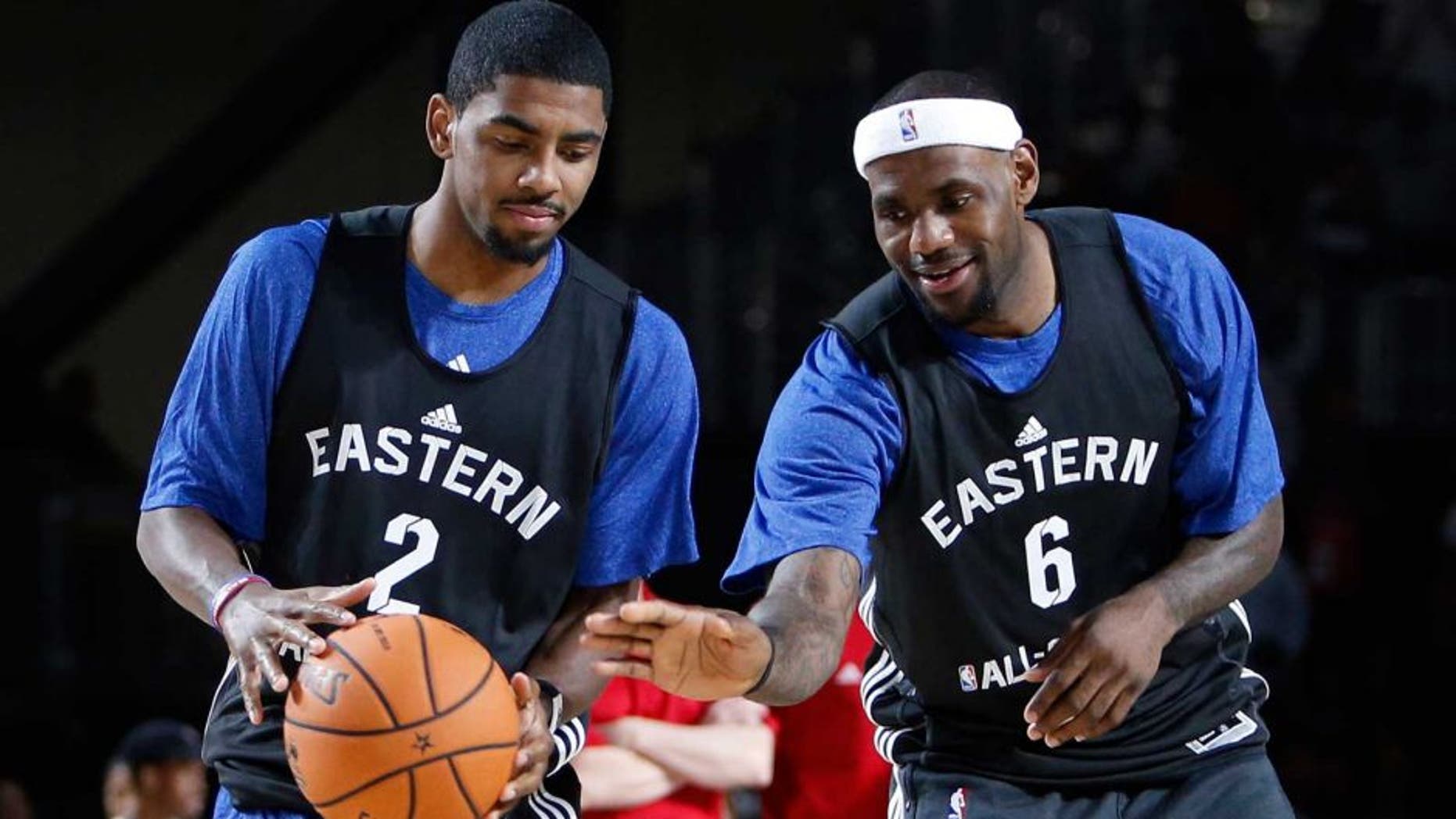 Feb 16, 2013; Houston, TX, USA; Eastern Conference forward LeBron James (6) of the Miami Heat tries to take the ball away from guard Kyrie Irving (2) of the Cleveland Cavaliers during practice for the 2013 NBA all star game at the George R. Brown Convention Center. Mandatory Credit: Brett Davis-USA TODAY Sports