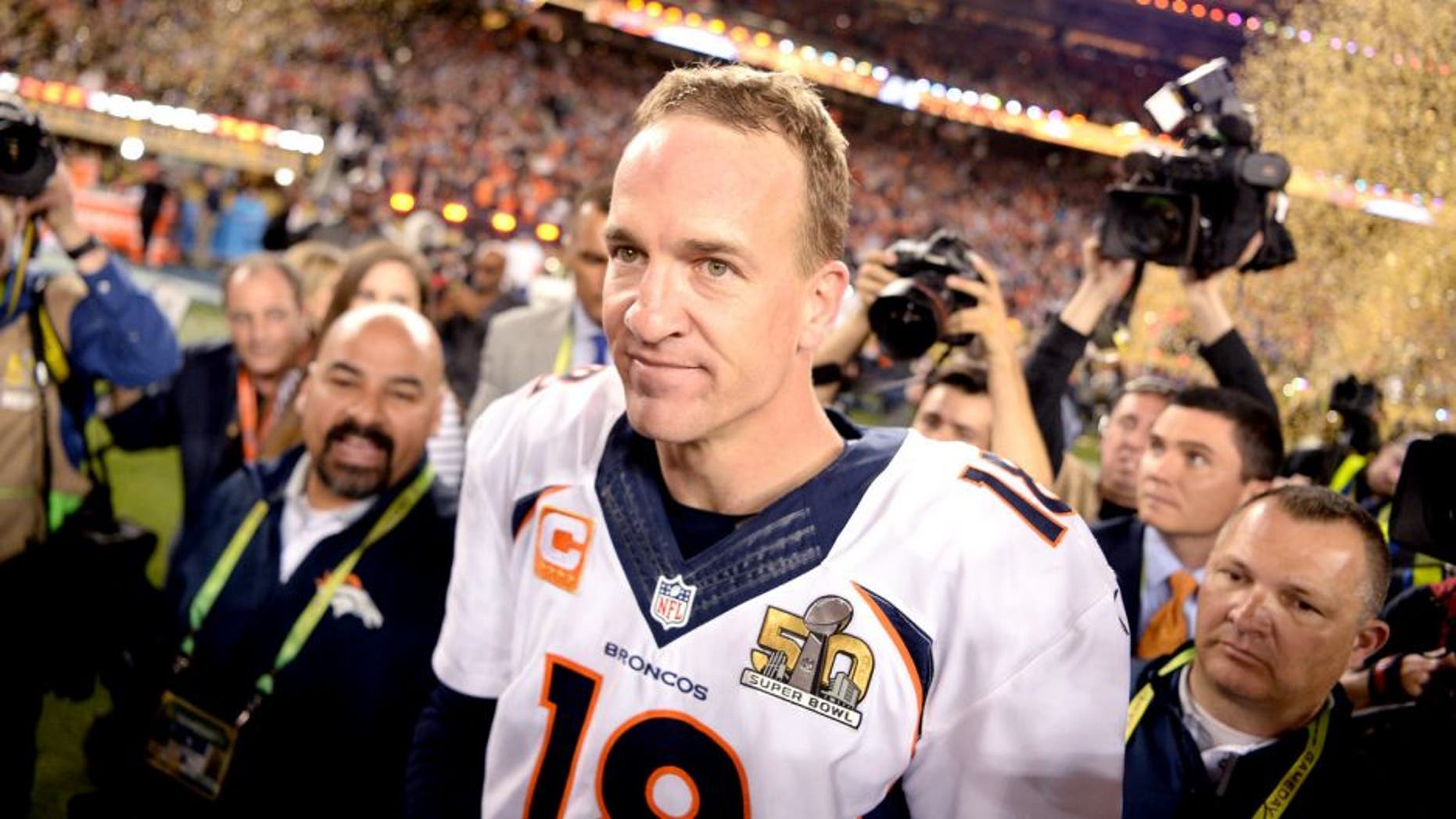 SANTA CLARA, CA - FEBRUARY 07: Peyton Manning (18) of the Denver Broncos walks through the crowd as the confetti flies after the Broncos win. The Denver Broncos played the Carolina Panthers in Super Bowl 50 at Levi's Stadium in Santa Clara, Calif. on February 7, 2016. (Photo by AAron Ontiveroz/The Denver Post via Getty Images)