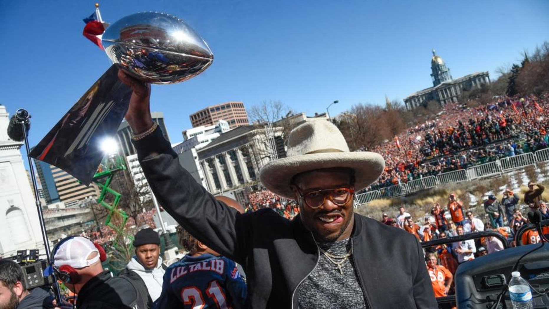 DENVER, CO - FEBRUARY 09: Denver Broncos Von Miller smiles as he holds up the Super Bowl trophy on the stage during the celebration. Von Miller was named MVP of Super Bowl 50 after their 24-10 victory over the Carolina Panthers. The Denver Broncos celebrated their Super Bowl victory with a a parade and celebration February 9, 2016 at the City & County Building. (Photo By John Leyba/The Denver Post via Getty Images)
