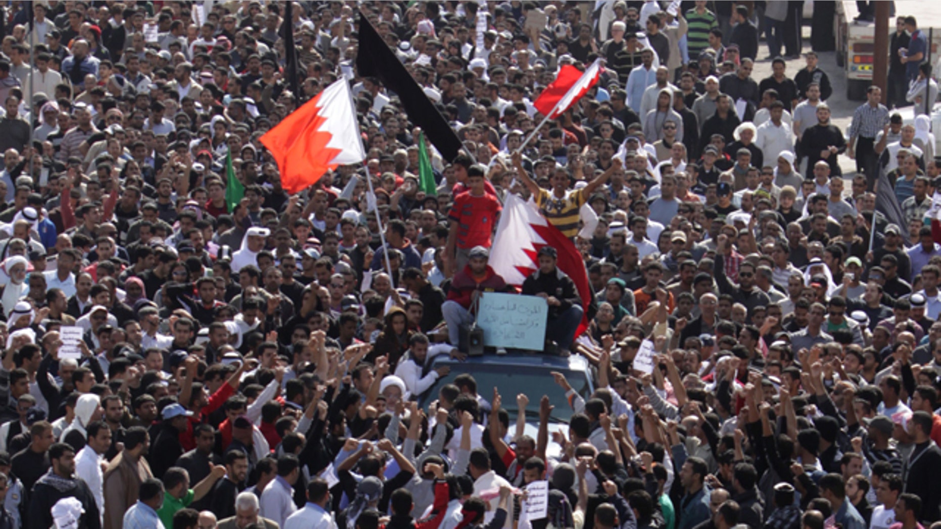 Feb. 15: A funeral procession for Ali Abdulhadi Mushaima, 21, moves slowly through the streets of Jidhafs, Bahrain.