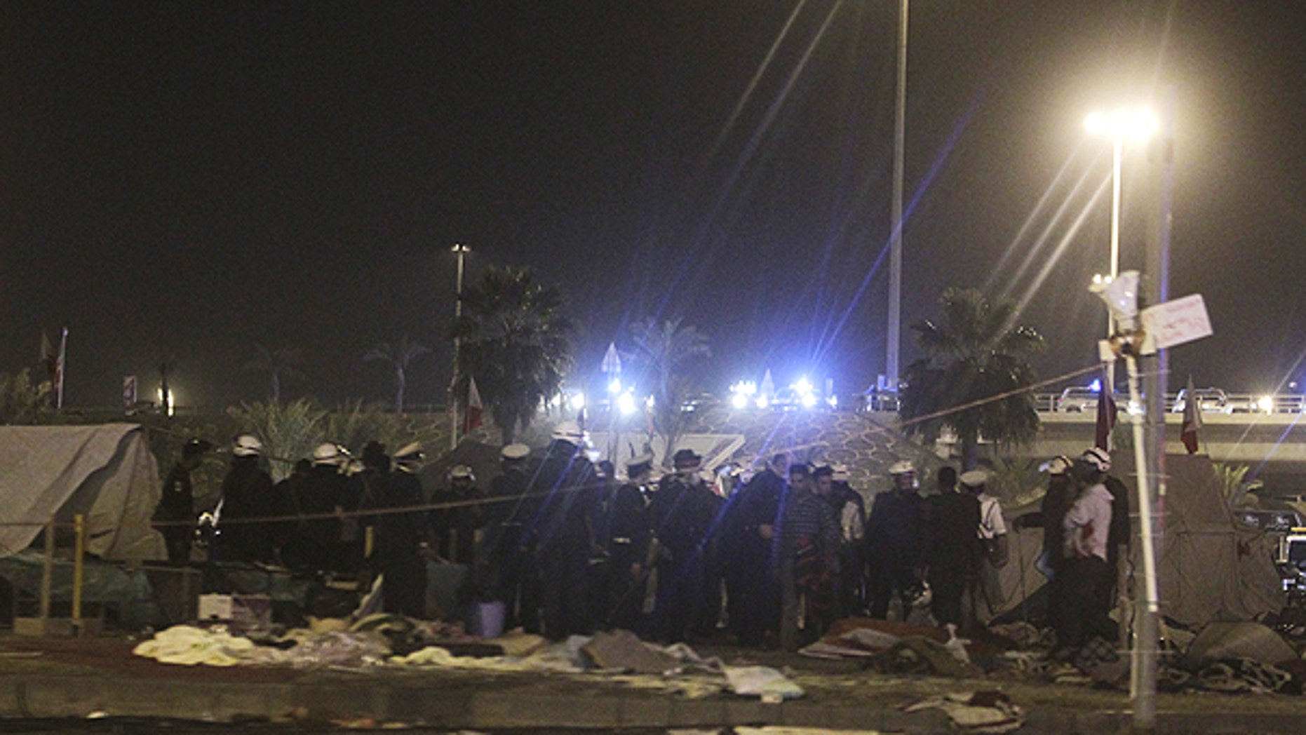 Feb. 17: Bahrani riot policemen are seen after attacking peaceful demonstrators camping at the Pearl roundabout, in Manama, Bahrain.