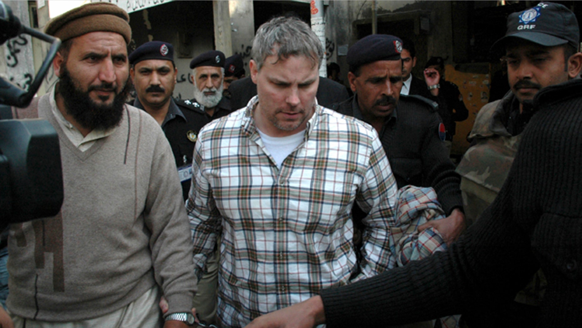 Jan. 28: Pakistani security officials escort Raymond A. Davis, a U.S. consulate employee, to a local court in Lahore, Pakistan.