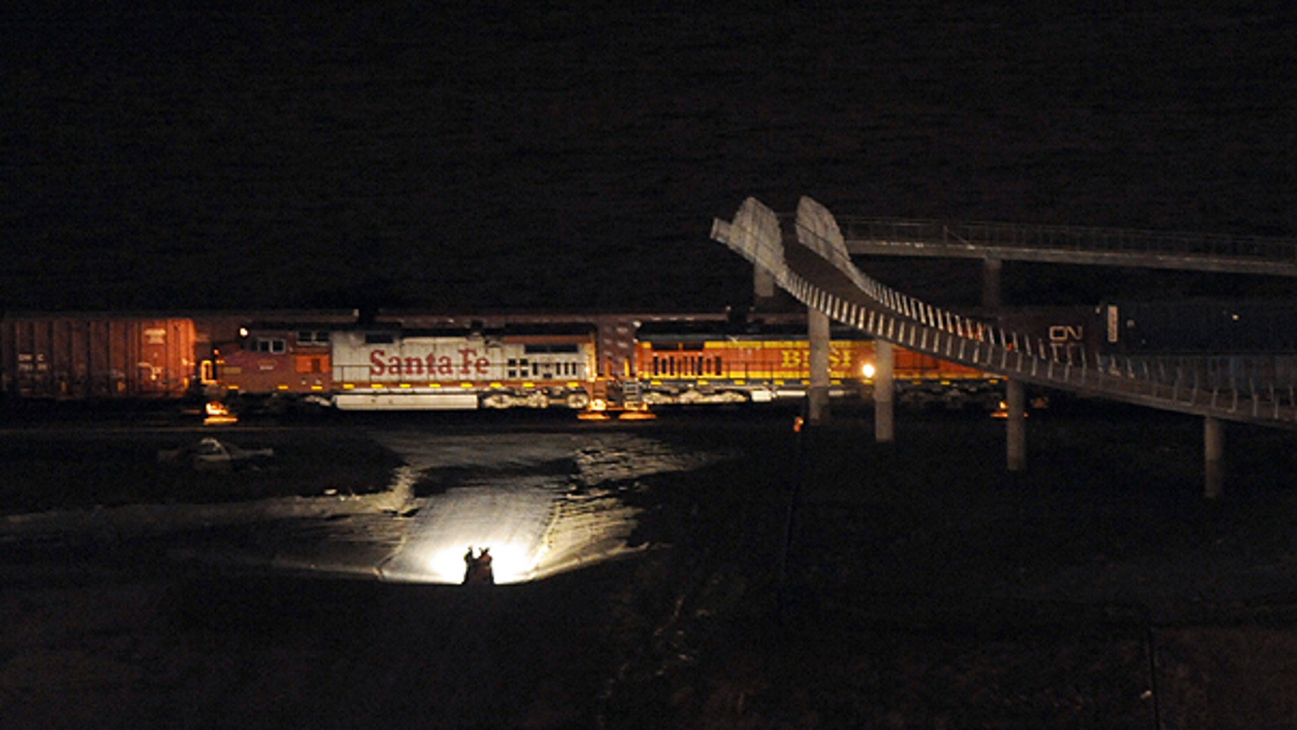 Feb. 26: ights from a truck illuminate train cars near Chambers Bay in University Place, Wash., after two trains collided.
