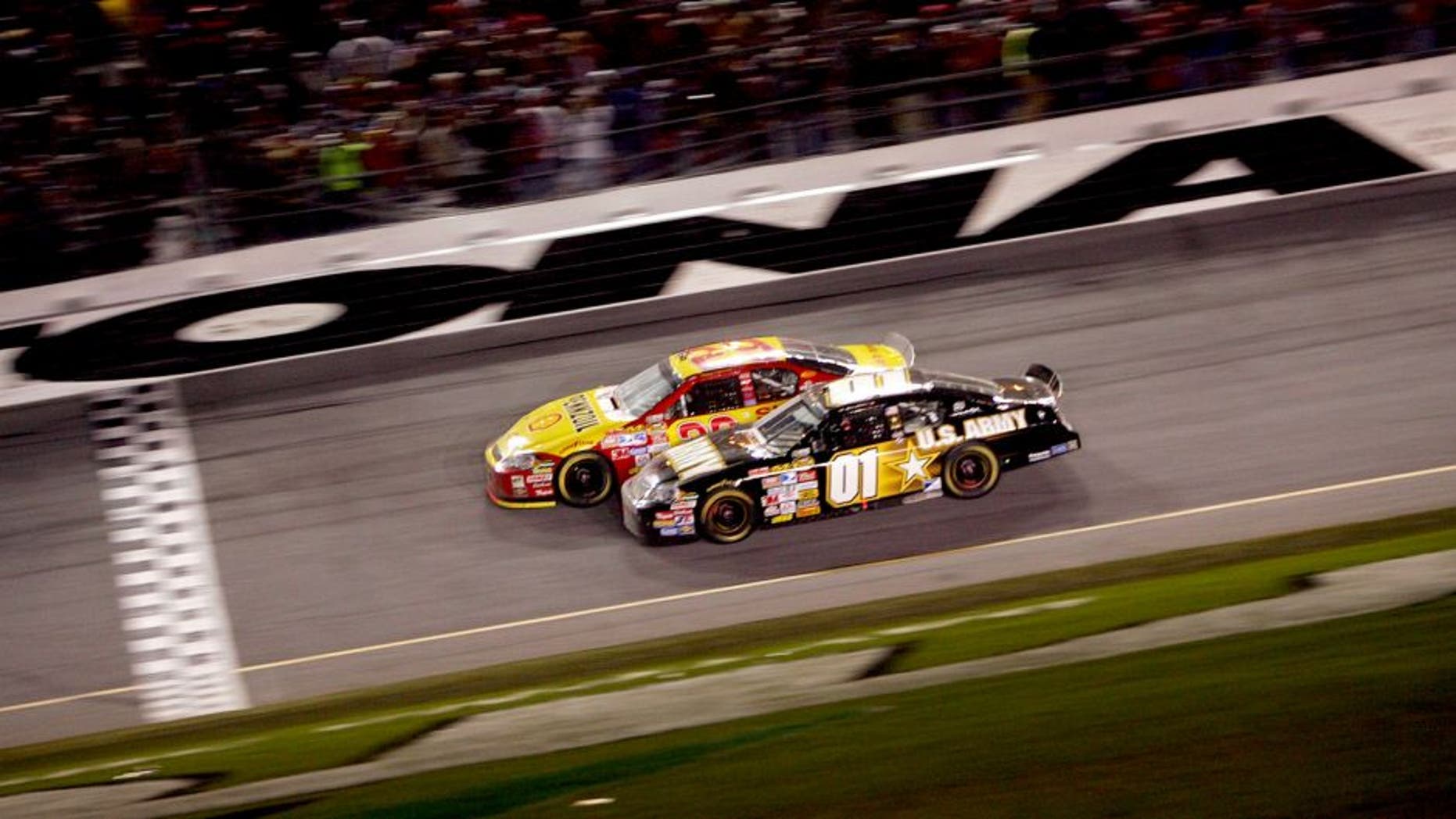 DAYTONA, FL - FEBRUARY 18: Kevin Harvick, driver of the #29 Shell/Pennzoil Chevrolet, leads Mark Martin, driver of the #01 U.S. ARMY Chevrolet, to the finish line to win the NASCAR Nextel Cup Series Daytona 500 at Daytona International Speedway on February 18, 2007 in Daytona, Florida. (Photo by Chris McGrath/Getty Images for NASCAR) *** Local Caption *** Kevin Harvick;Mark Martin